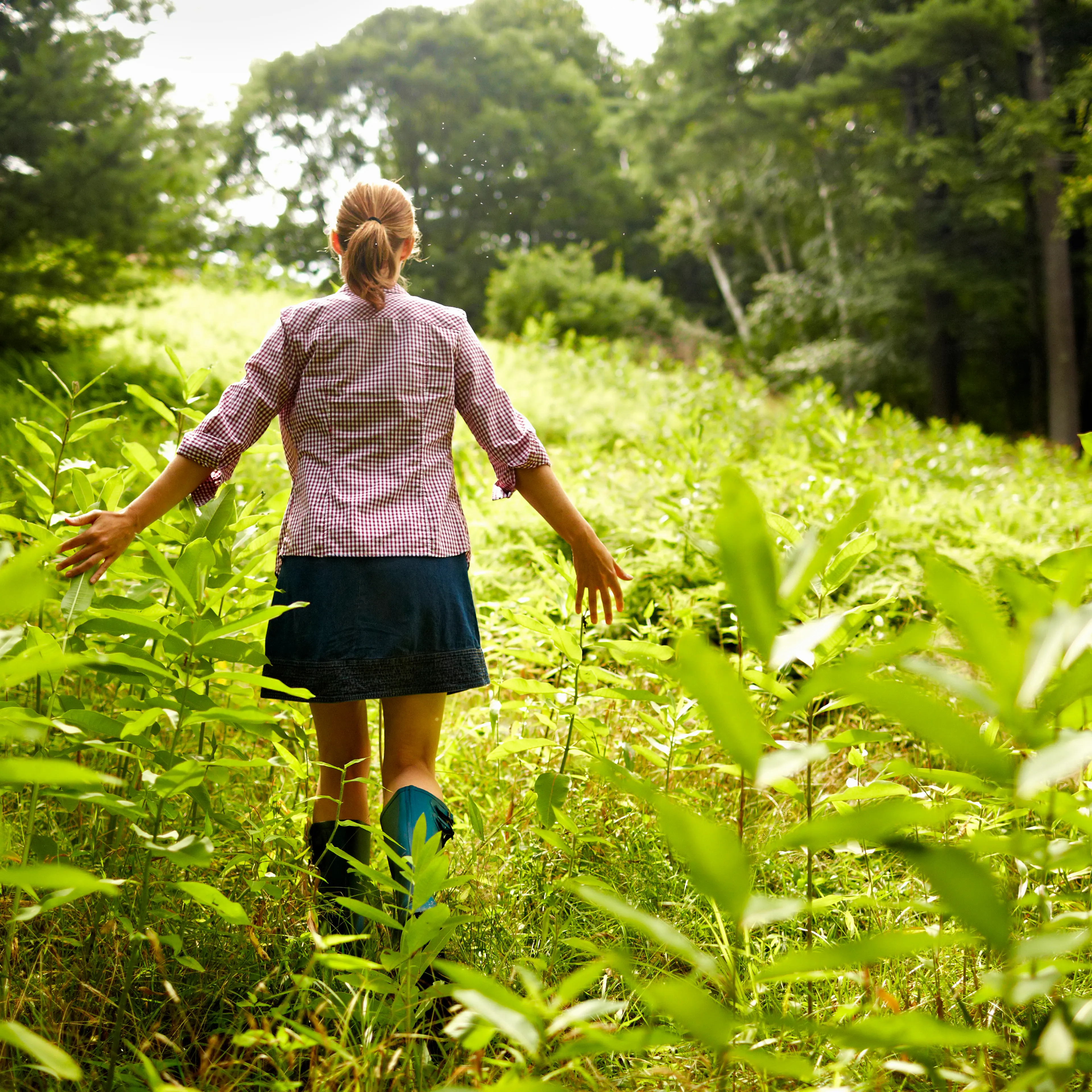 A woman walking through nature