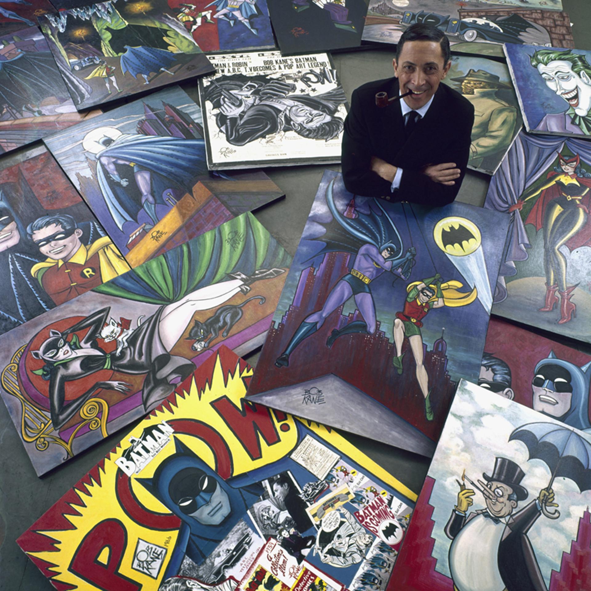 Comic book artist Bob Kane, who created Batman, poses with his iconic illustrations, 1966.