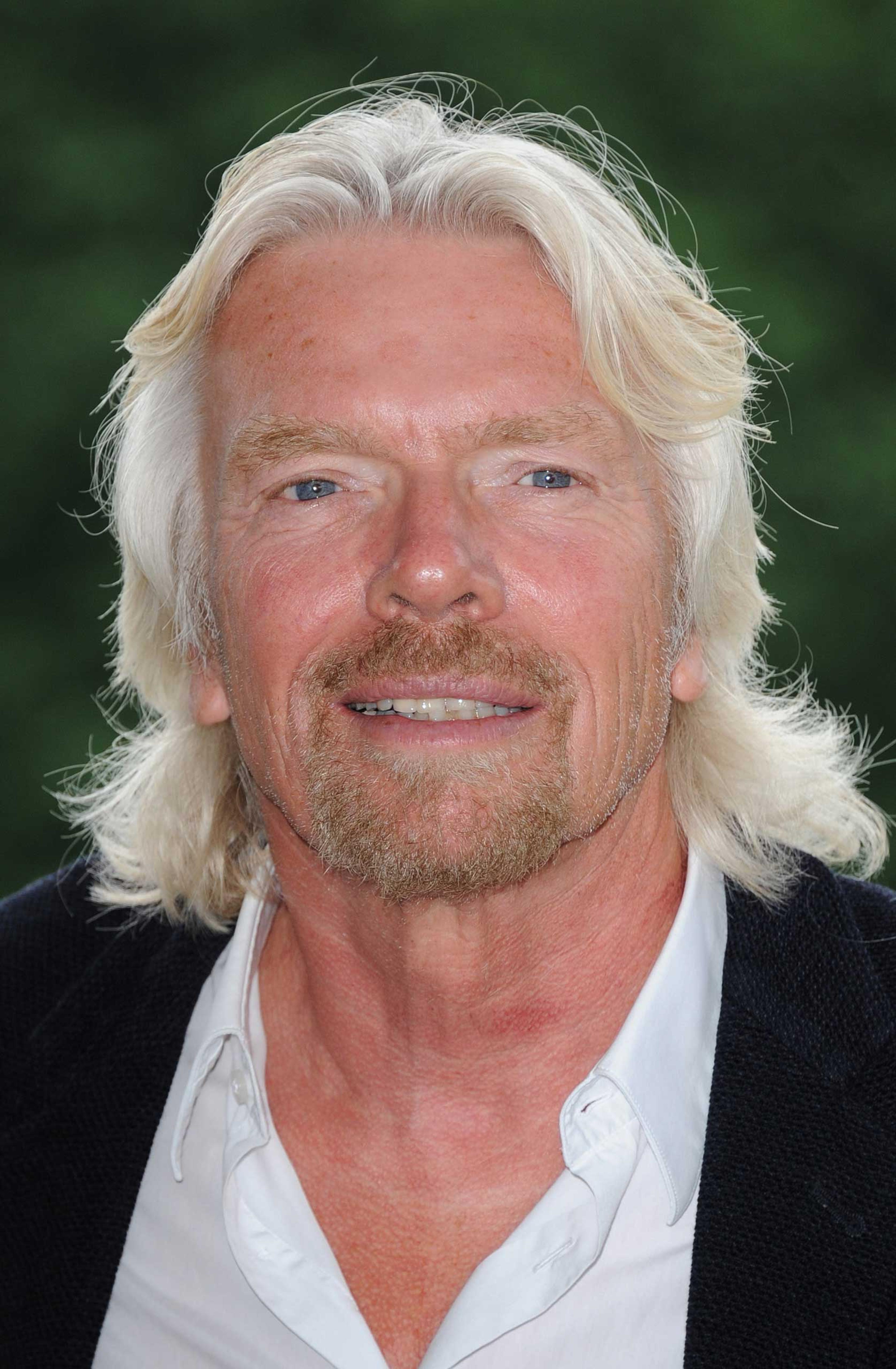 Sir Richard Branson attends a photocall to reveal his celebrity team taking part in this year's Virgin Active London Triathlon at Virgin Active Chiswick Riverside on July 3, 2012 in London.