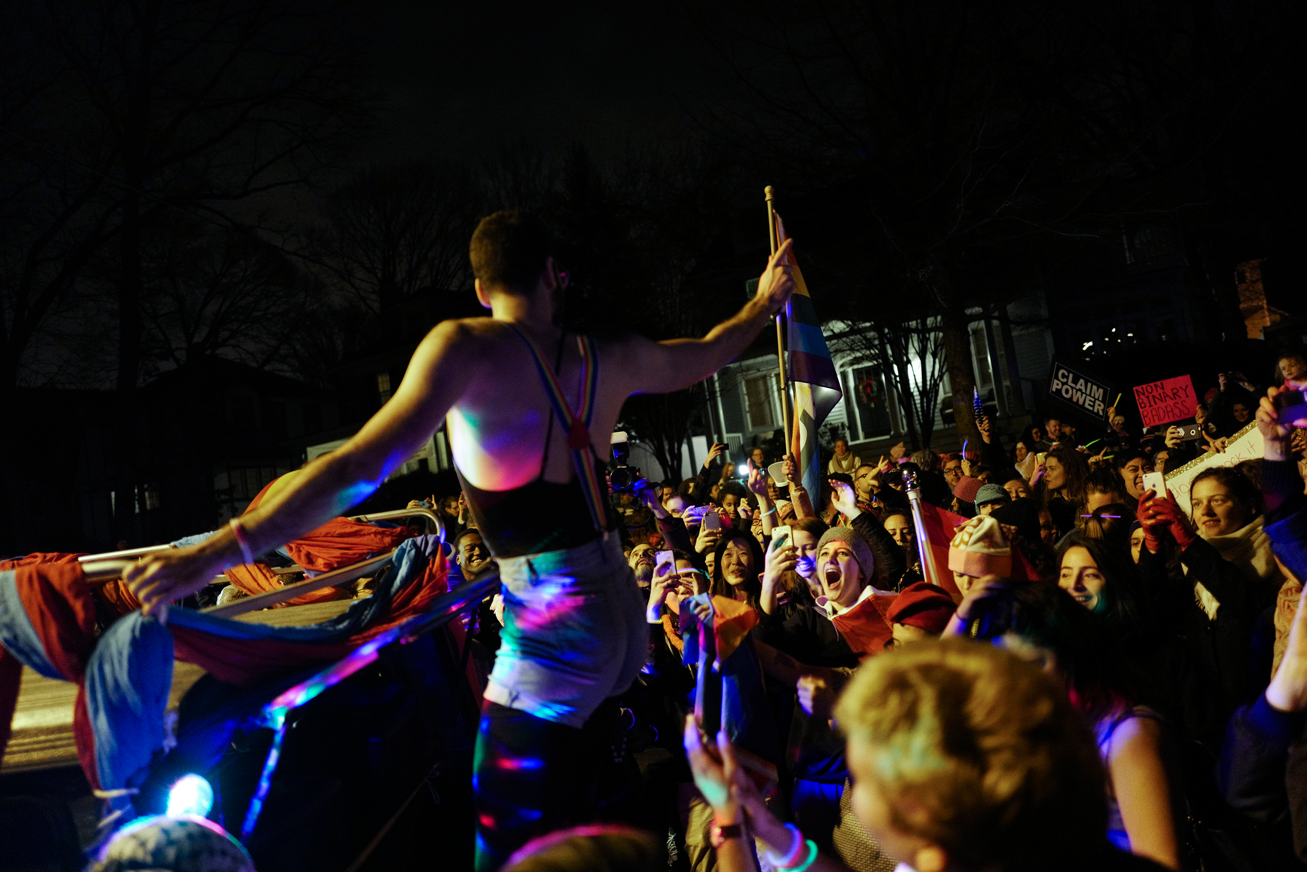 A man is cheered at a dance event organized by LGBTQ activist groups DisruptJ20 and WERK for Peace outside Vice President-Elect Mike Pence's temporary residence in Chevy Chase, Md., on Jan. 18, 2017. The protest targeted Pence's record on gay and transge