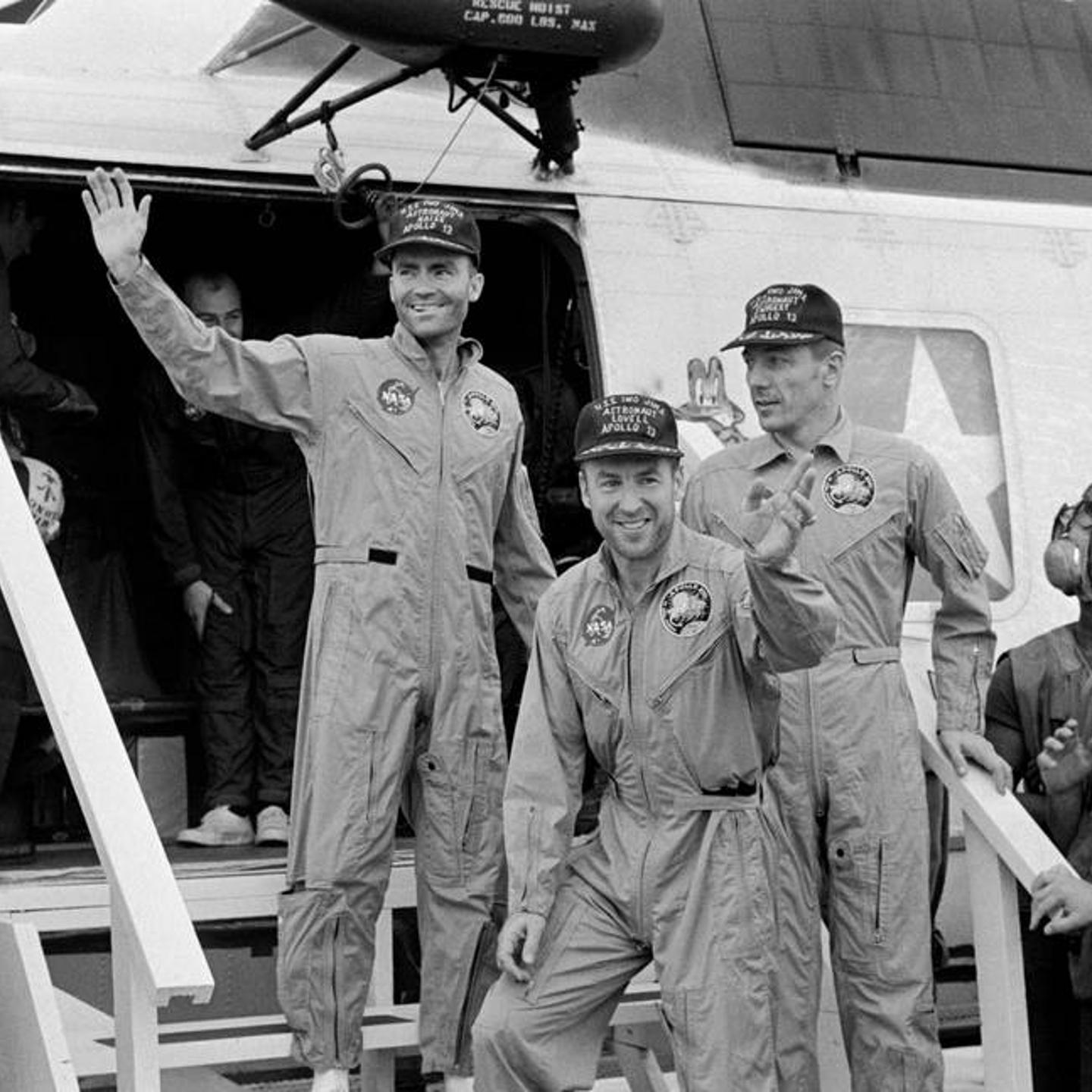 (Left to Right) Fred Haise, Jim Lovell and Jack Swigert, the crew of Apollo 13, step aboard the USS Iwo Jima, prime recovery ship for the mission, following splashdown and recovery operations in the South Pacific Ocean on April 17, 1970.