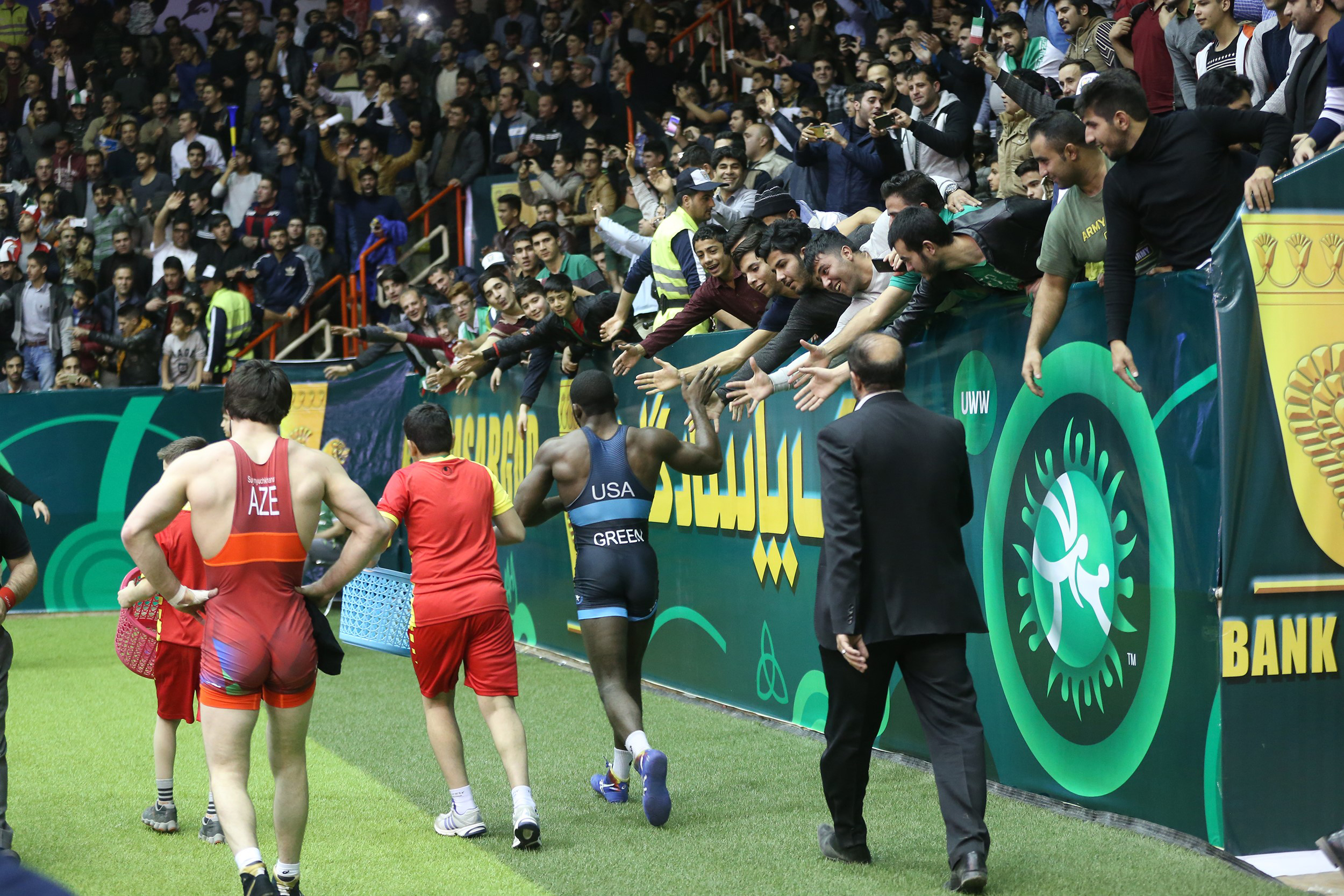 James Malcolm Green of Team USA and David Suynyuchkhanov of Azerbaijan walk after their match at the Freestyle World Cup in 74 kg at Imam Khomeini Sports Venue in Kermanshah, Iran, on Feb. 17, 2017.