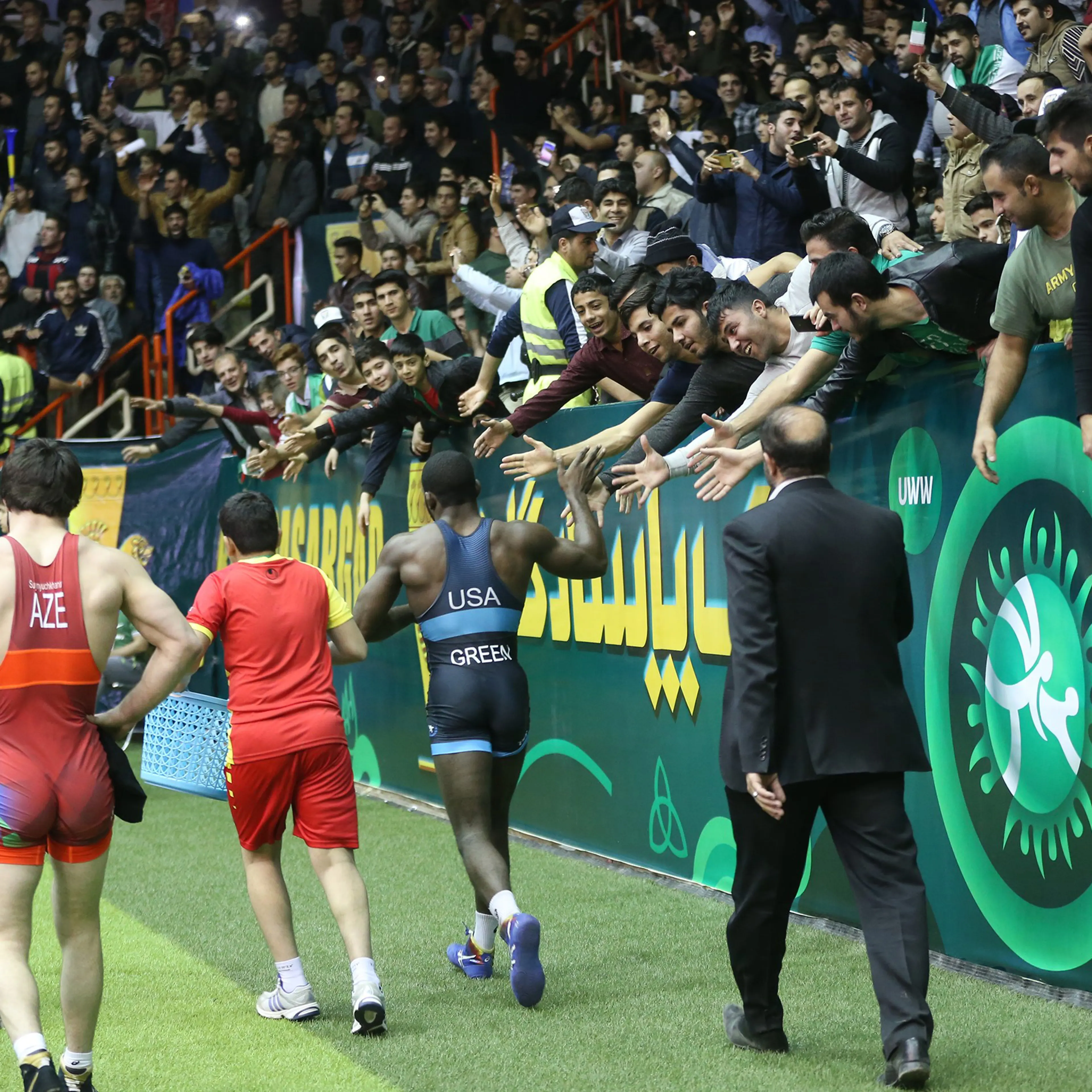 James Malcolm Green of Team USA and David Suynyuchkhanov of Azerbaijan walk after their match at the Freestyle World Cup in 74 kg at Imam Khomeini Sports Venue in Kermanshah, Iran, on Feb. 17, 2017.