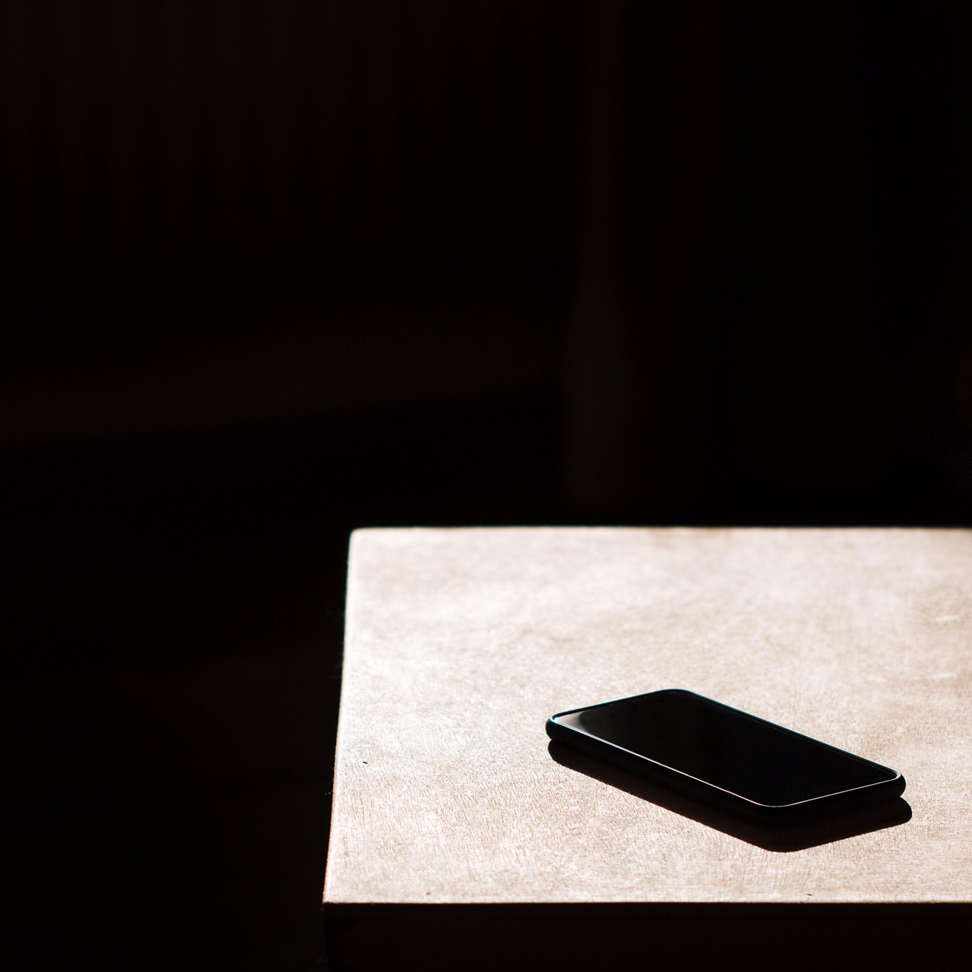 A cellphone on a table to represent people in Chad living without social media for a year