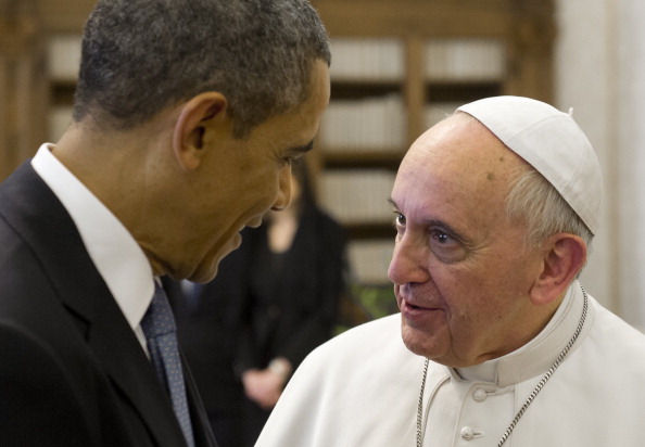 Pope Francis (R) speaks with President Barack Obama during a private audience on March 27, 2014 at the Vatican.