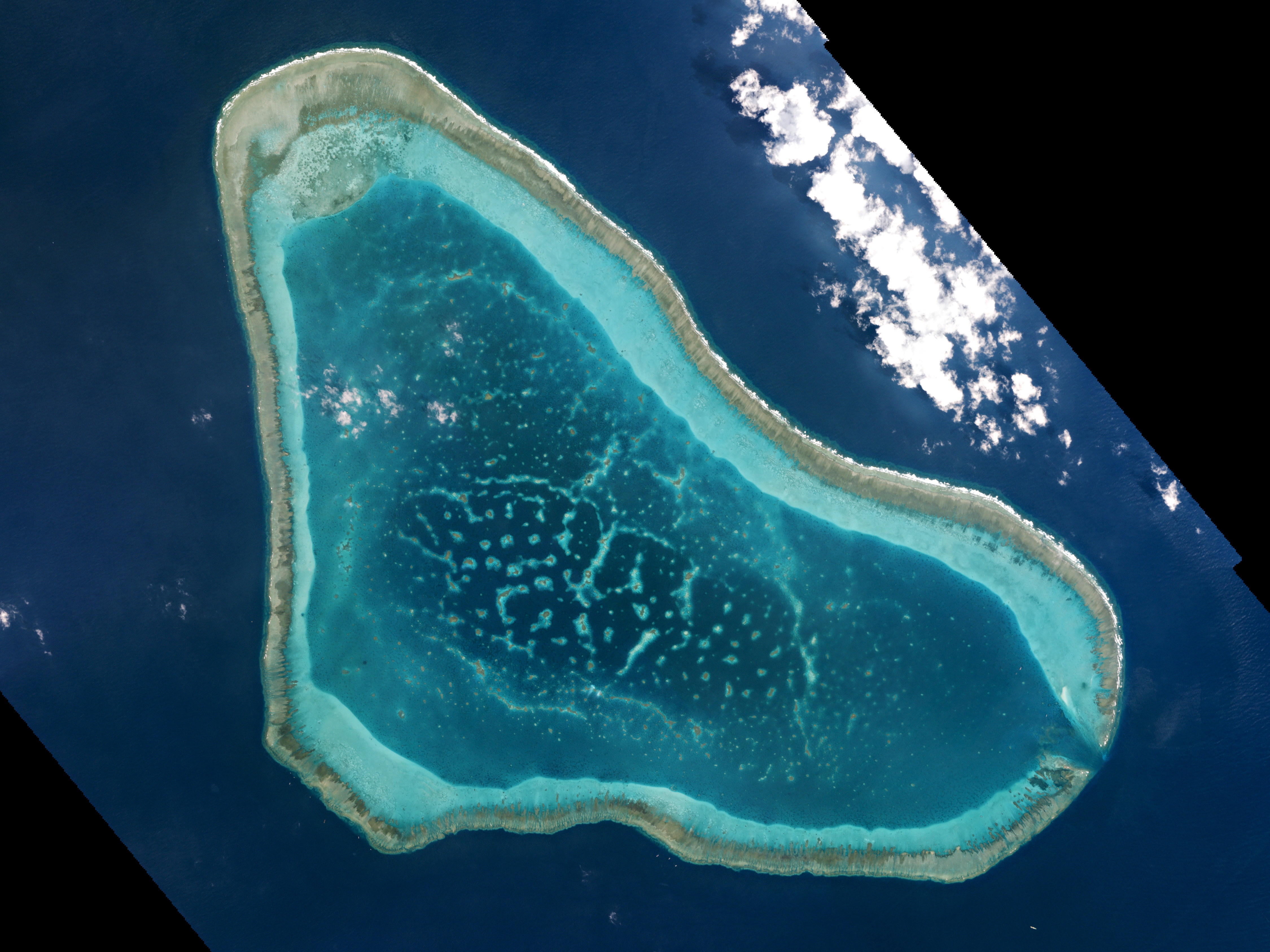 Boats at Scarborough Shoal in the South China Sea are shown in this handout photo provided by Planet Labs