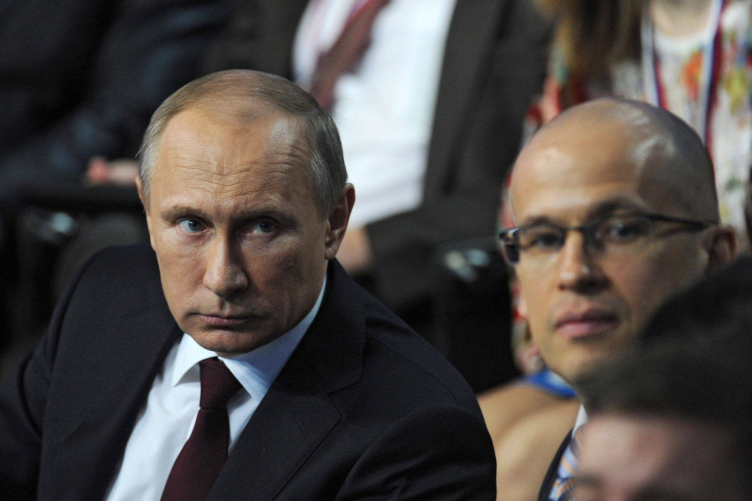 From left: Russia's President Vladimir Putin attends a televised meeting with regional media in St. Petersburg, on April 24, 2014.