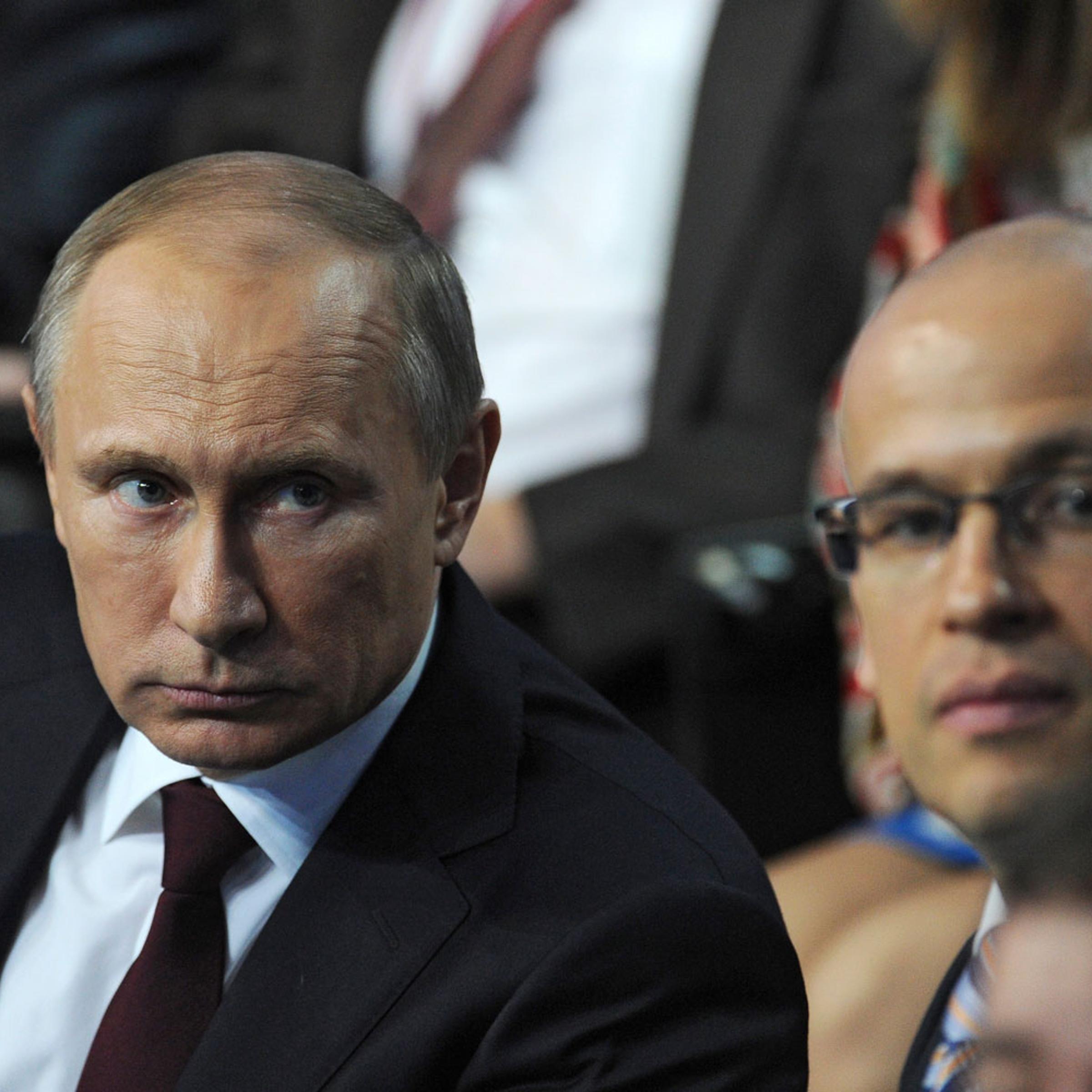 From left: Russia's President Vladimir Putin attends a televised meeting with regional media in St. Petersburg, on April 24, 2014.