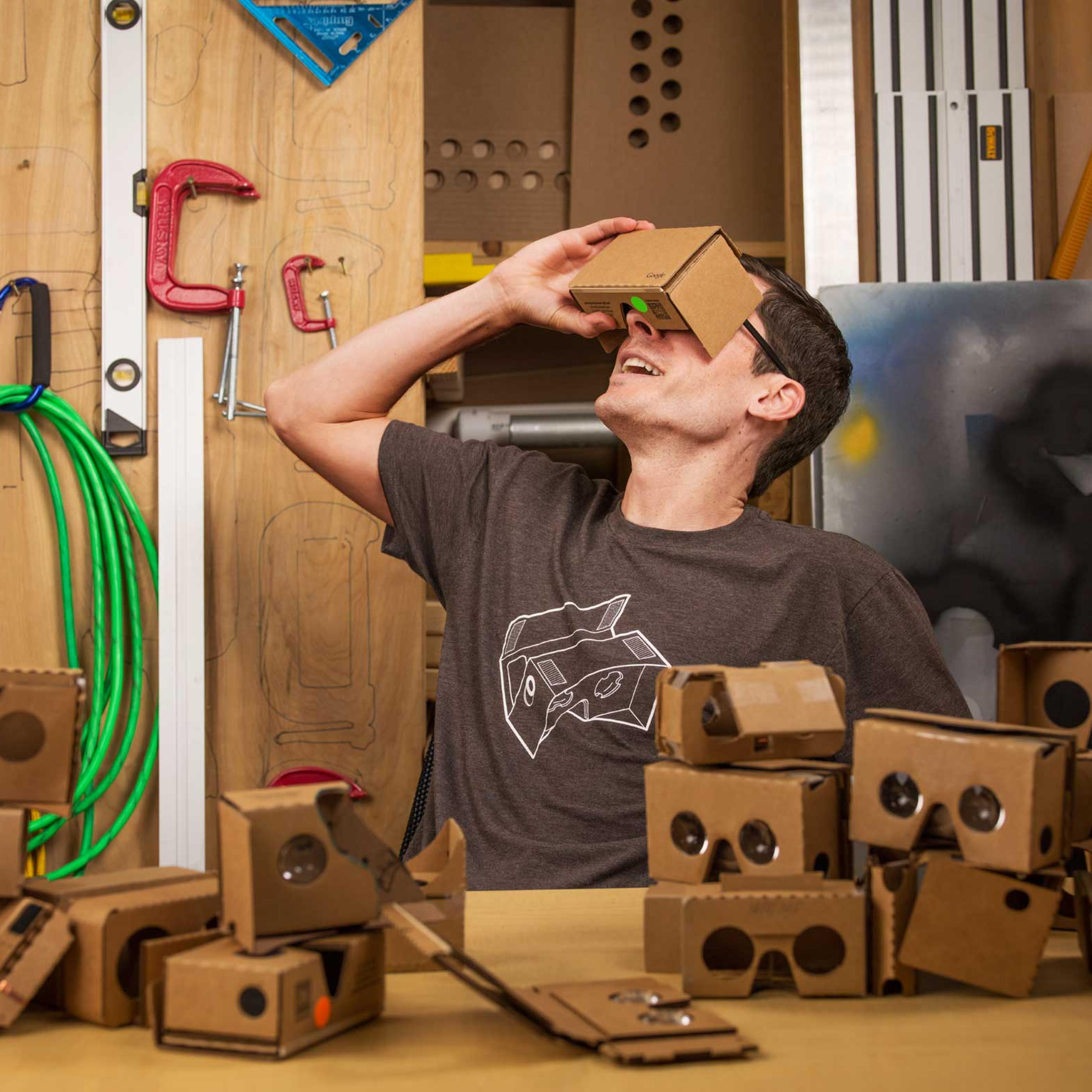 Clay Bavor wears a Google Cardboard headset in the google woodworking shop in googles hq in mountain view, CA on june 24, 2015.