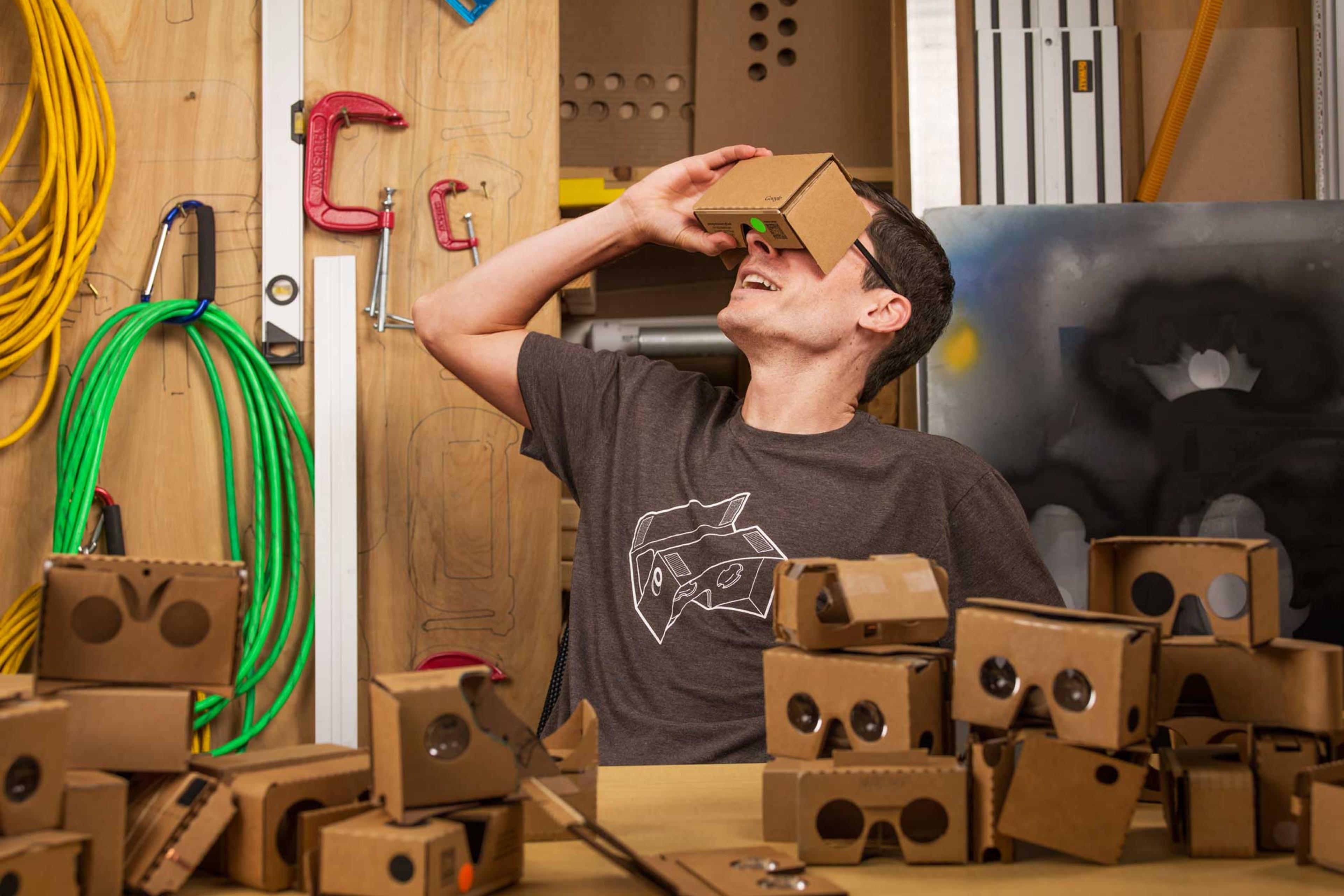 Clay Bavor wears a Google Cardboard headset in the google woodworking shop in googles hq in mountain view, CA on june 24, 2015.