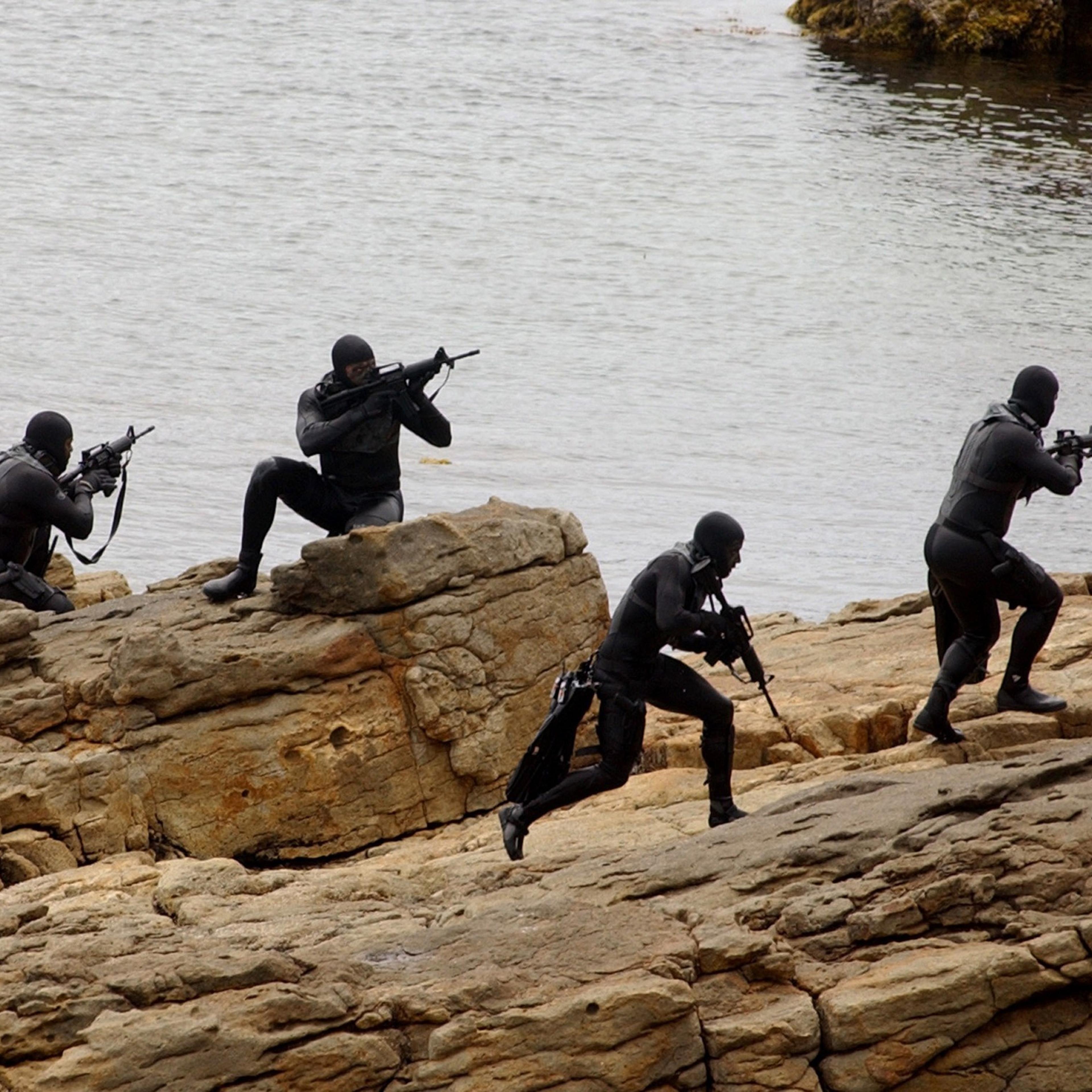 Navy SEALs practice Over The Beach evolutions during a training exercise on May 25, 2004 in a Remote Training Facility.