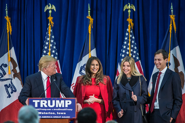 Republican presidential candidate Donald Trump (L) is joined on stage by his wife Melania Trump, daughter Ivanka Trump, and son-in-law Jared Kushner (L-R) at a campaign rally at the Ramada Waterloo Hotel and Convention Center on February 1, 2016 in Water