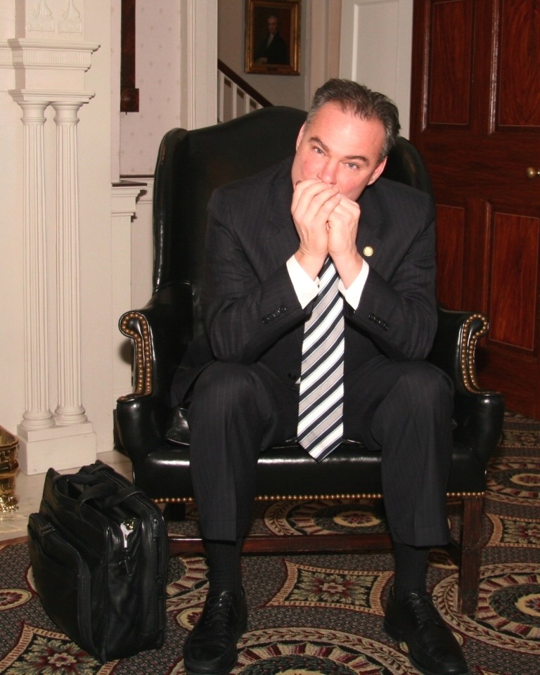 Tim Kaine playing one of his harmonicas