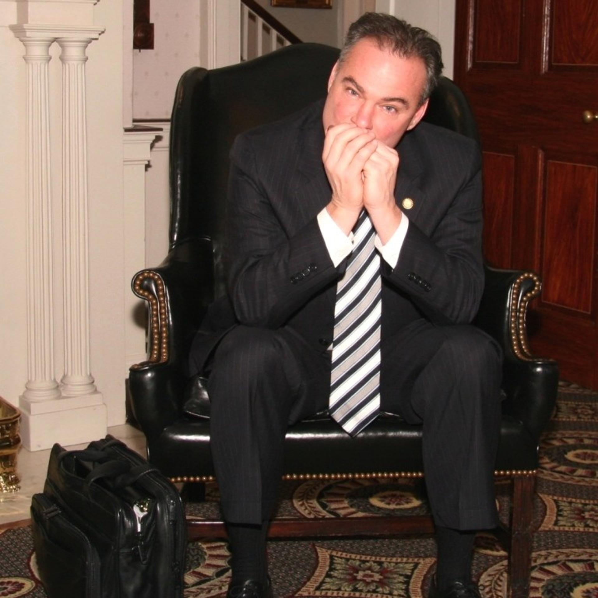 Tim Kaine playing one of his harmonicas
