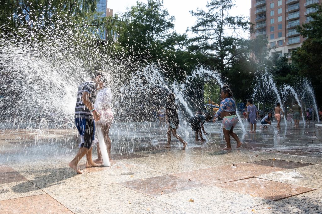 Children play and cool off at a splash park in downtown Houston, Texas, United States, on June 15, 2023. From U.S. south central state of Texas to southeastern Florida, about 35 million people are bracing for a widespread heat wave.