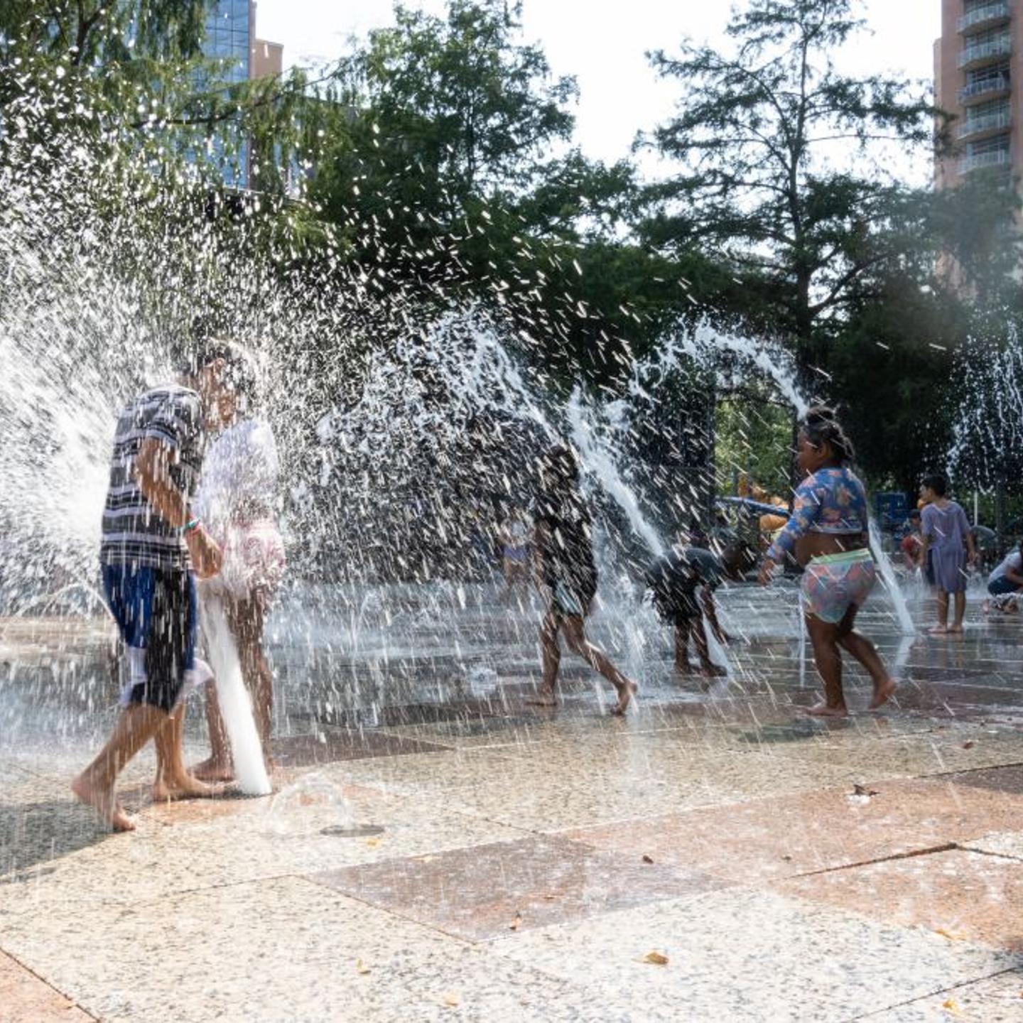 Children play and cool off at a splash park in downtown Houston, Texas, United States, on June 15, 2023. From U.S. south central state of Texas to southeastern Florida, about 35 million people are bracing for a widespread heat wave.