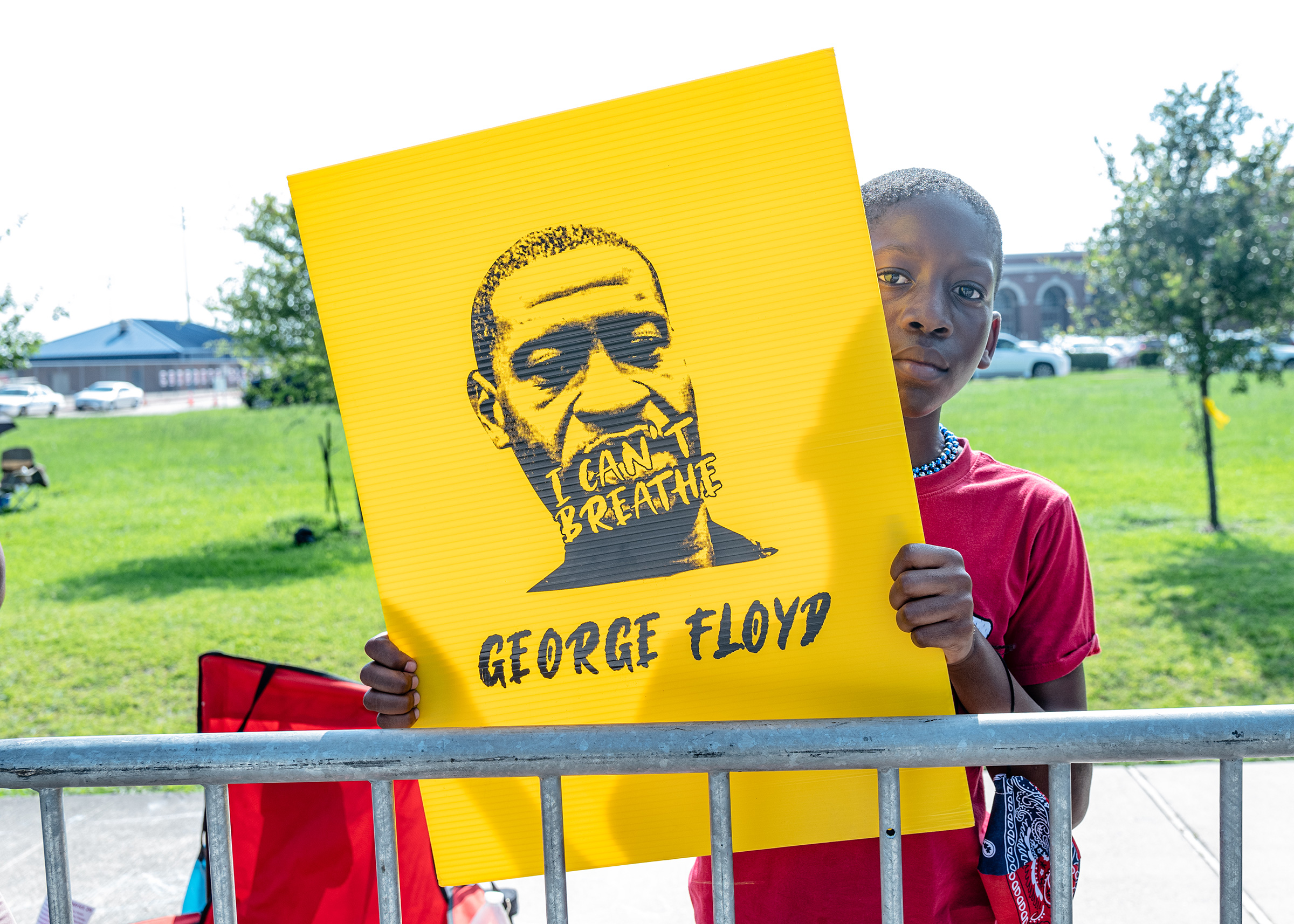 Engwin Williams, 10, awaits the passing of George Floyd's casket in Houston on June 9.