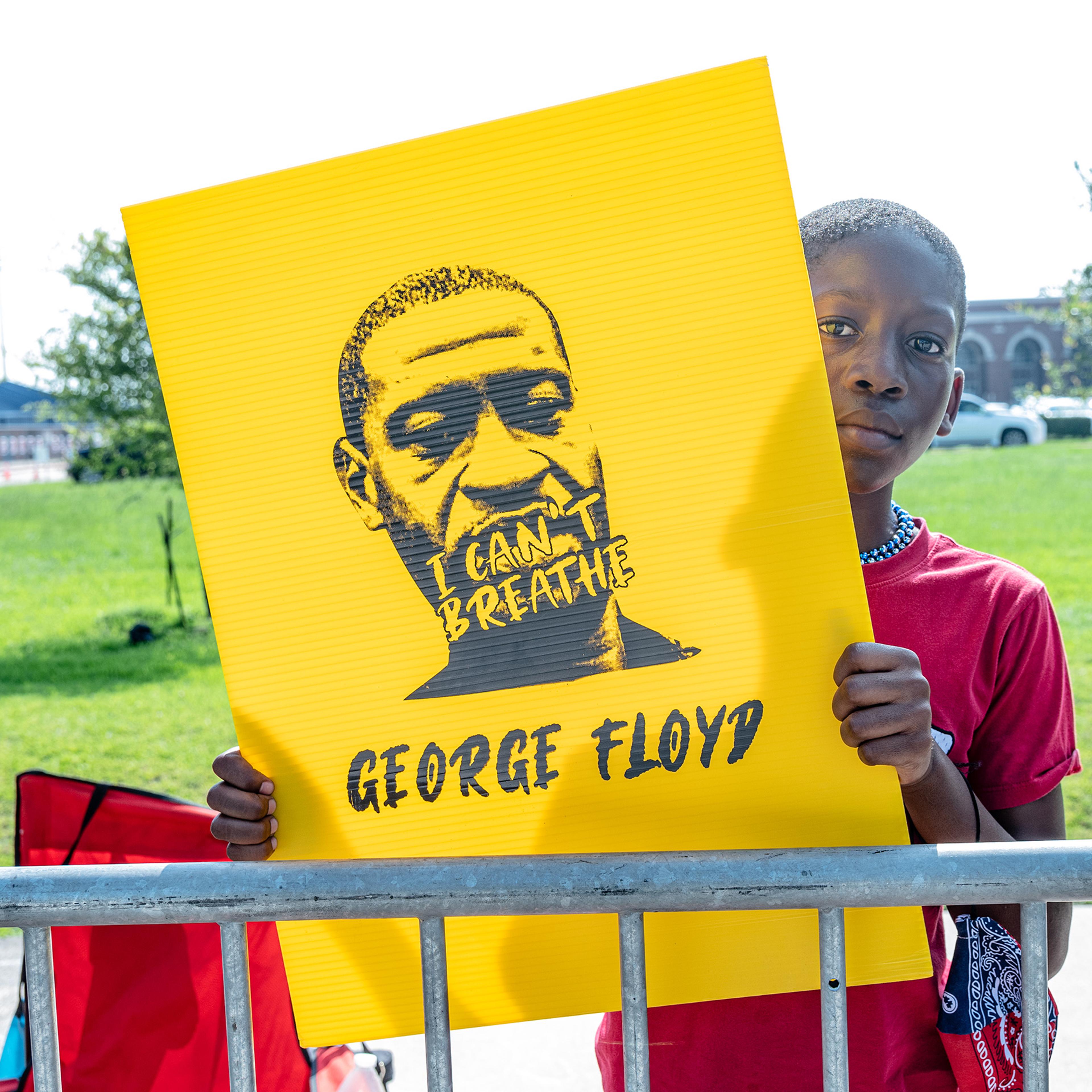 Engwin Williams, 10, awaits the passing of George Floyd's casket in Houston on June 9.