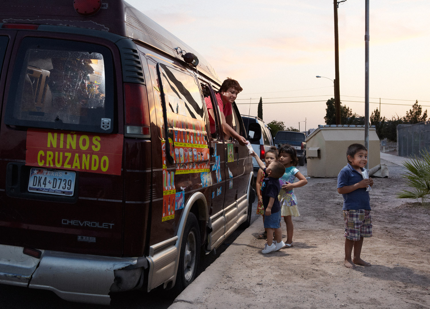 Rosa and her makeshift ice cream truck delight the neighborhood kids.