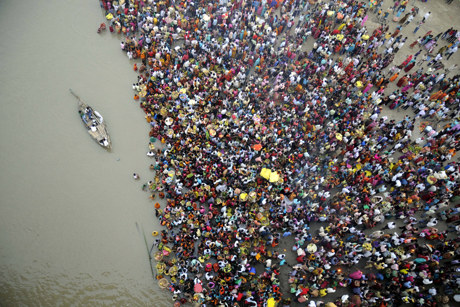 November 1, 2011. Hindu devotees in the Indian state of Bihar wade into the Ganges during an annual festival honoring the sun deity.