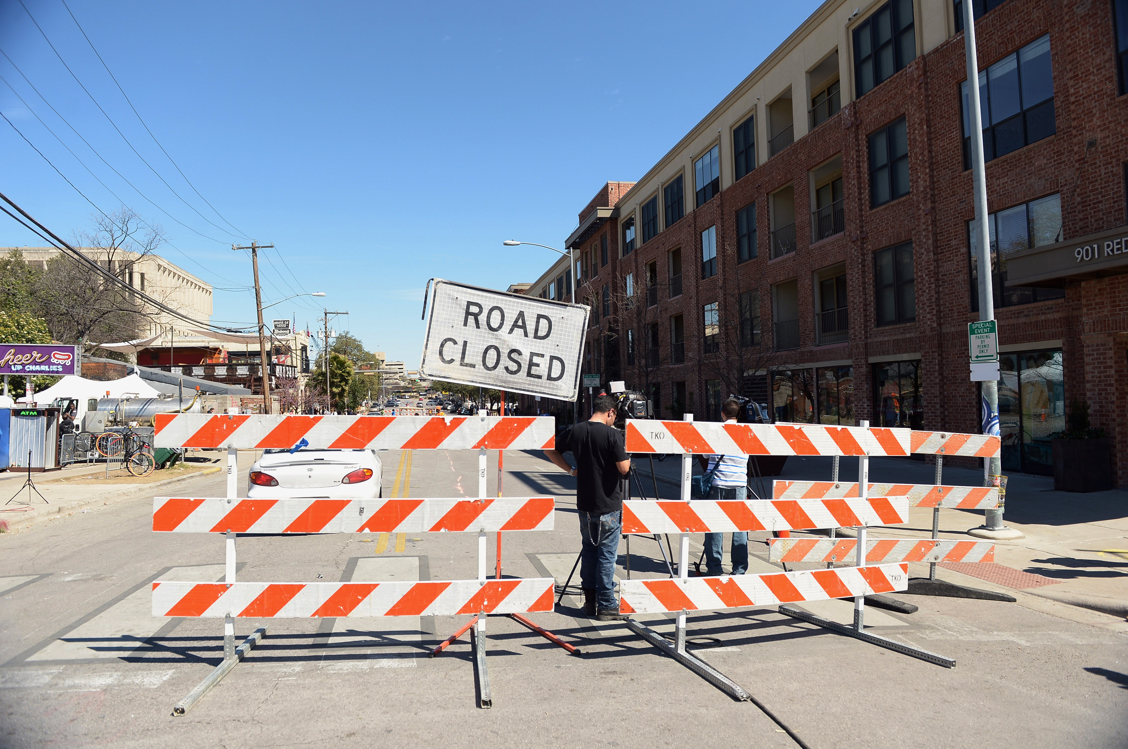 Barricades stand near the scene of a deadly car accident at the South by Southwest Music, Film and Interactive Festival on March 13, 2014 in Austin.