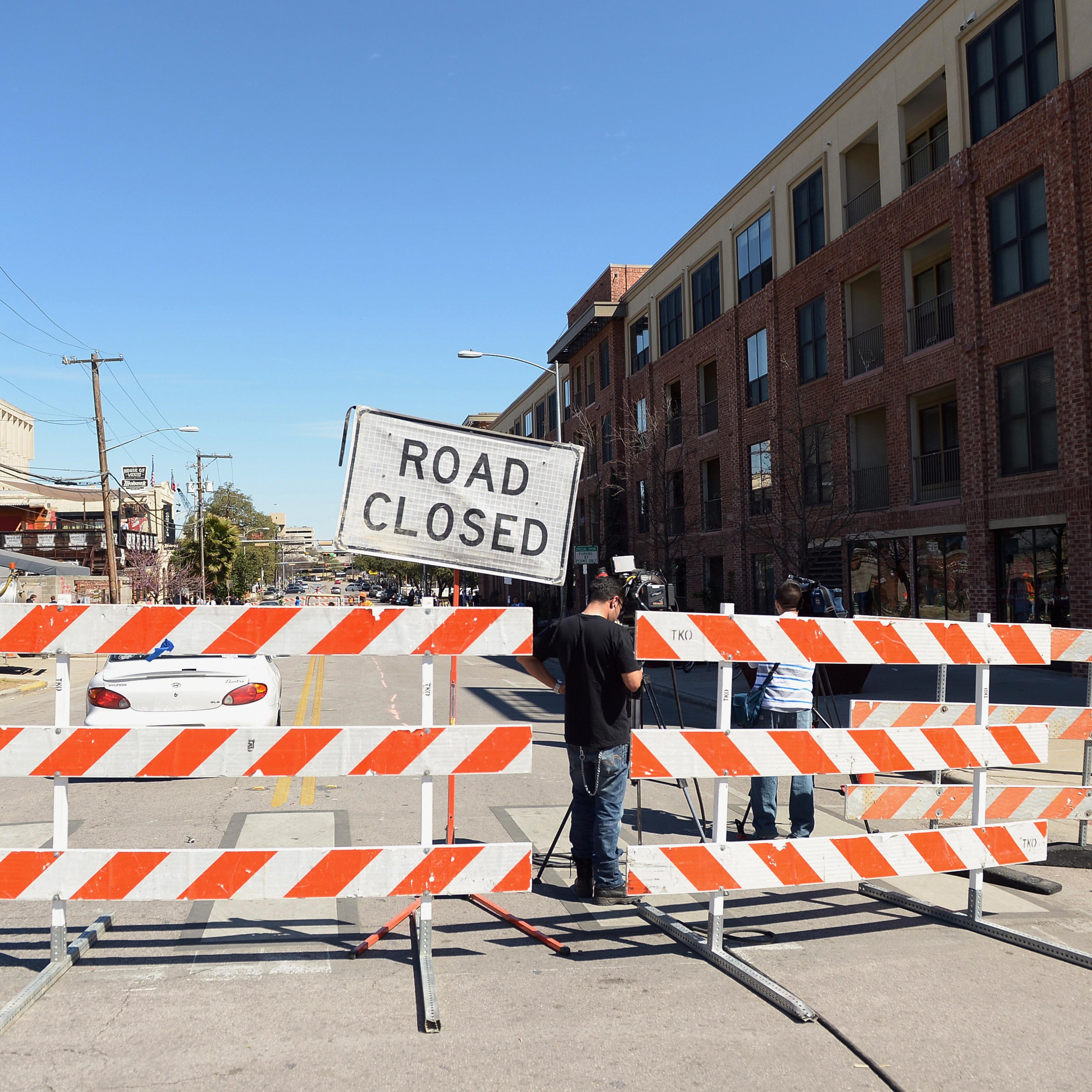 Barricades stand near the scene of a deadly car accident at the South by Southwest Music, Film and Interactive Festival on March 13, 2014 in Austin.