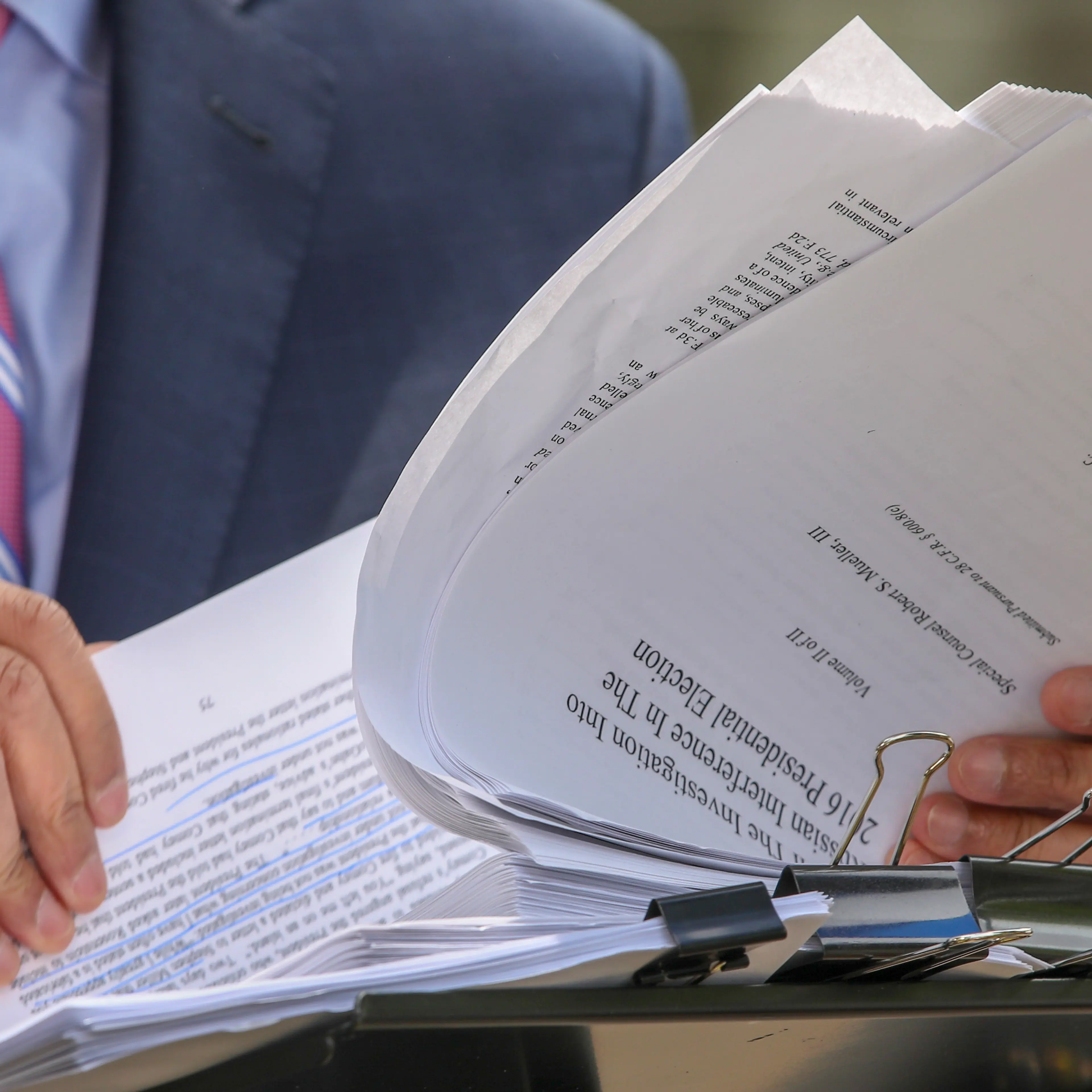 Television crews go over the Mueller Report outside the U.S. Department of Justice in Washington, D.C., on April 18, 2019.