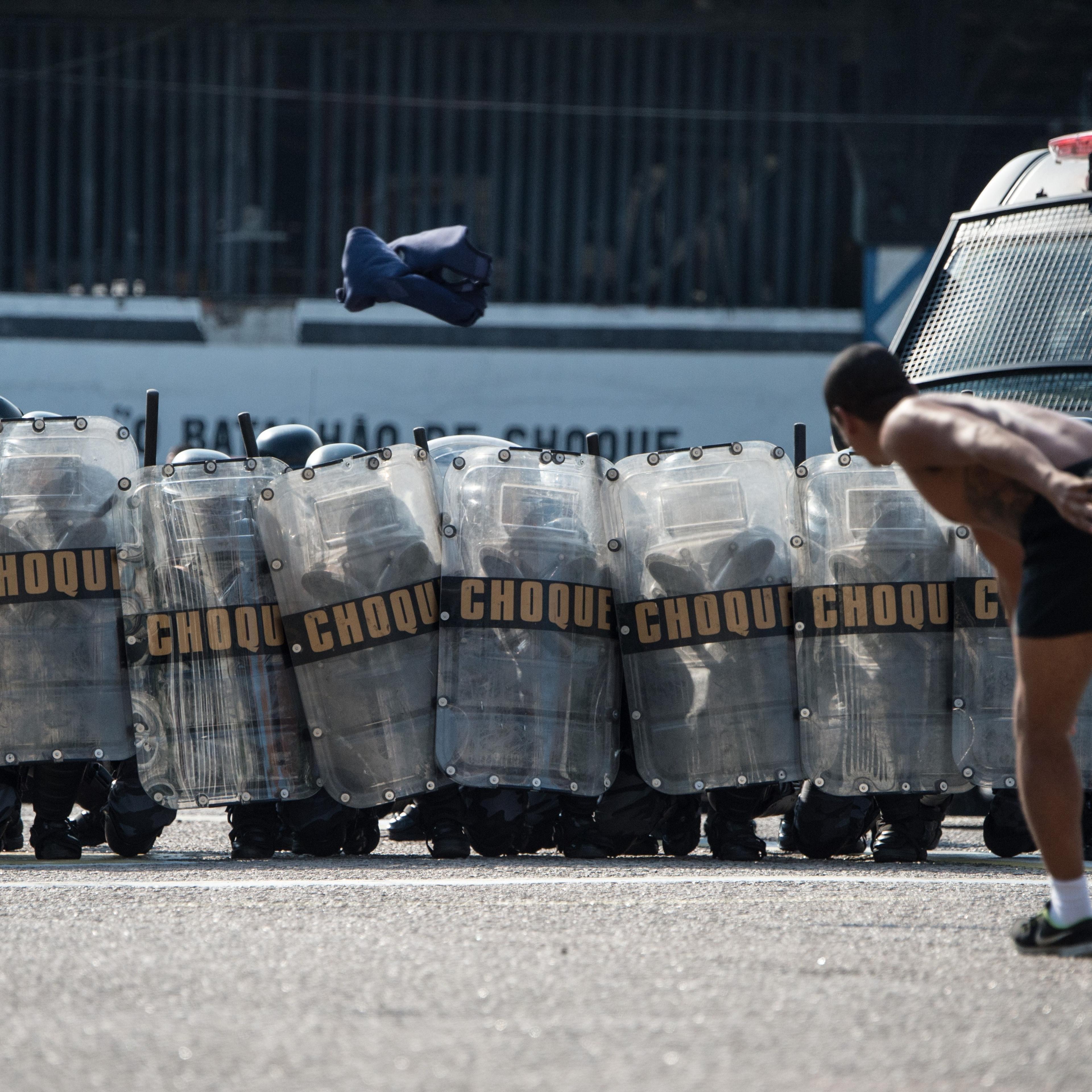 The Special Riot Police unit (CHOQUE) carries out a drill for controlling civil disorders, at their headquarters in Rio de Janeiro, Brazil, on May 15, 2014.