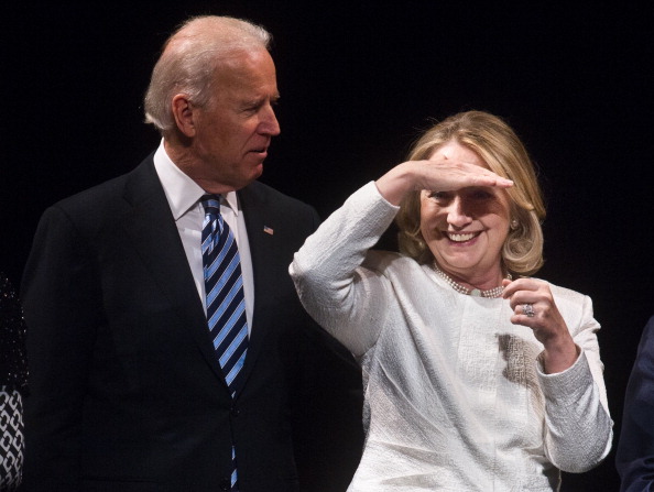 Former US Secretary of State Hillary Clinton looks out at the audience with Vice President Joe Biden at the end of the Vital Voices Global Awards ceremony at the Kennedy Center in Washington on April 2, 2013.