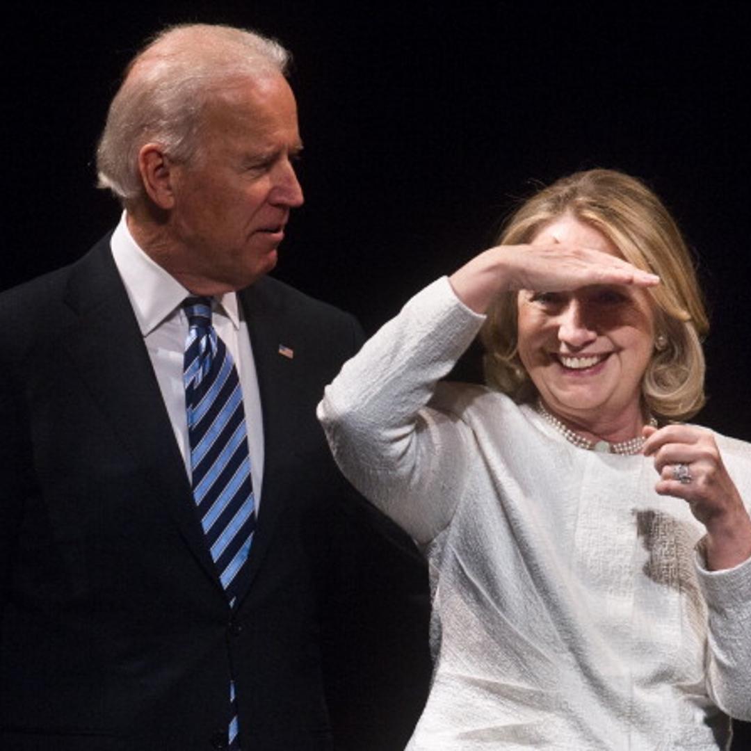 Former US Secretary of State Hillary Clinton looks out at the audience with Vice President Joe Biden at the end of the Vital Voices Global Awards ceremony at the Kennedy Center in Washington on April 2, 2013.