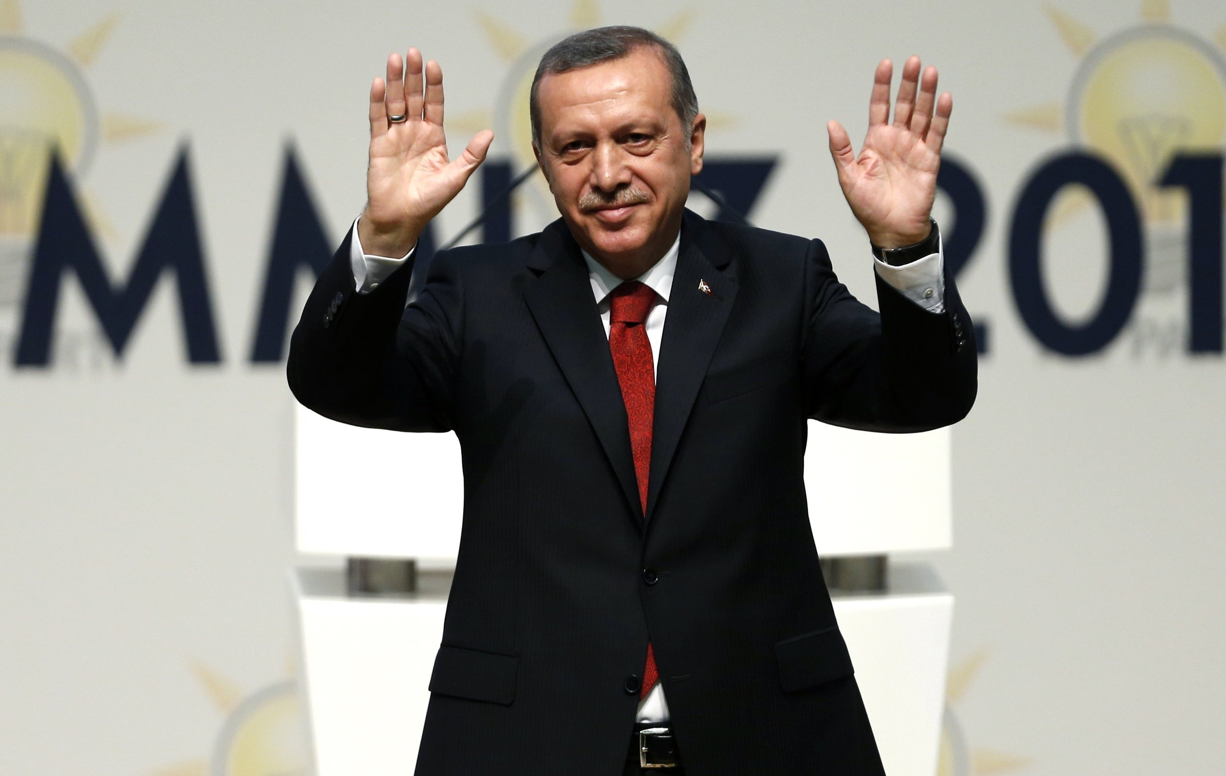 Turkey's PM Erdogan greets AK Party members at a meeting where he is named as his party's candidate for the country's first direct presidential election in Ankara