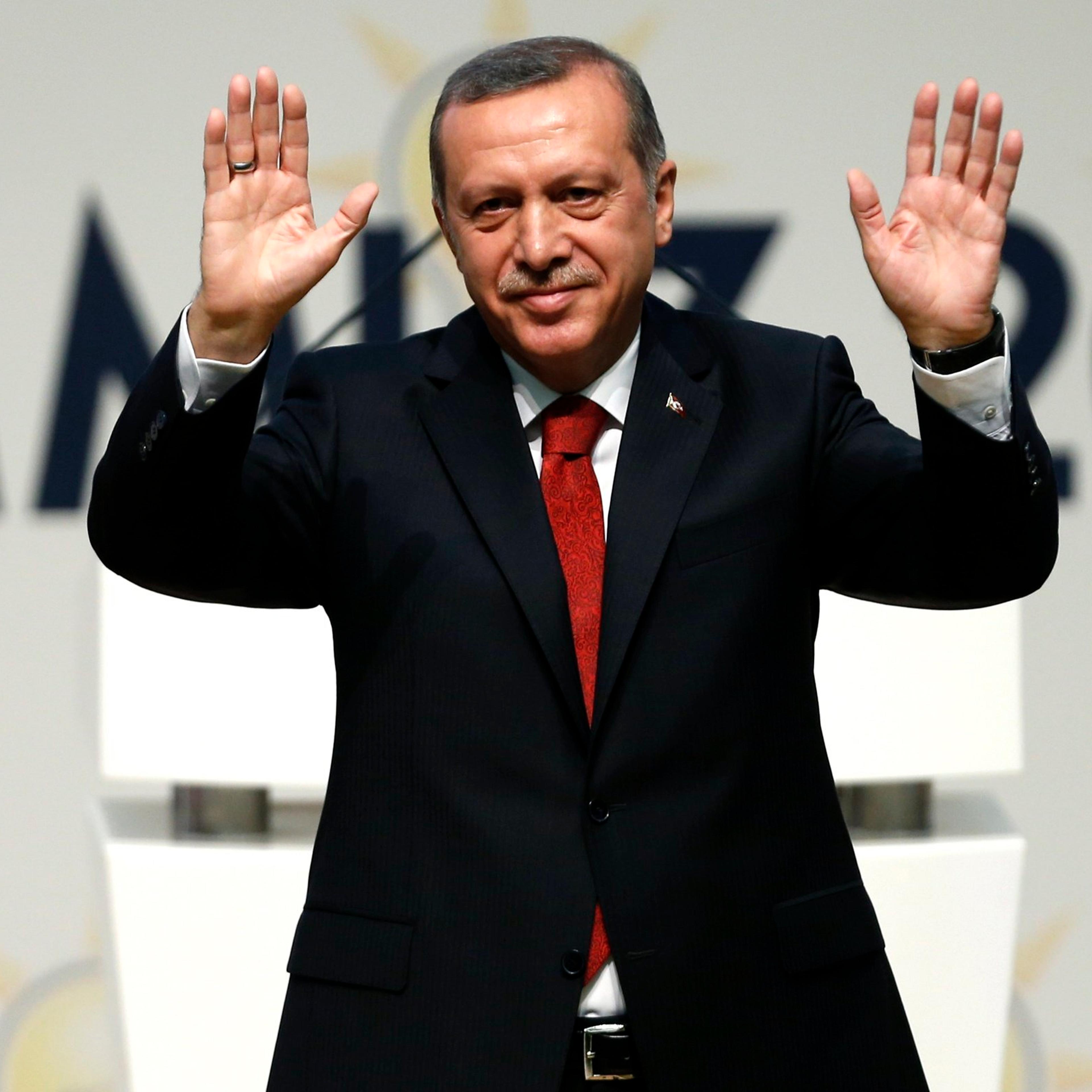 Turkey's PM Erdogan greets AK Party members at a meeting where he is named as his party's candidate for the country's first direct presidential election in Ankara