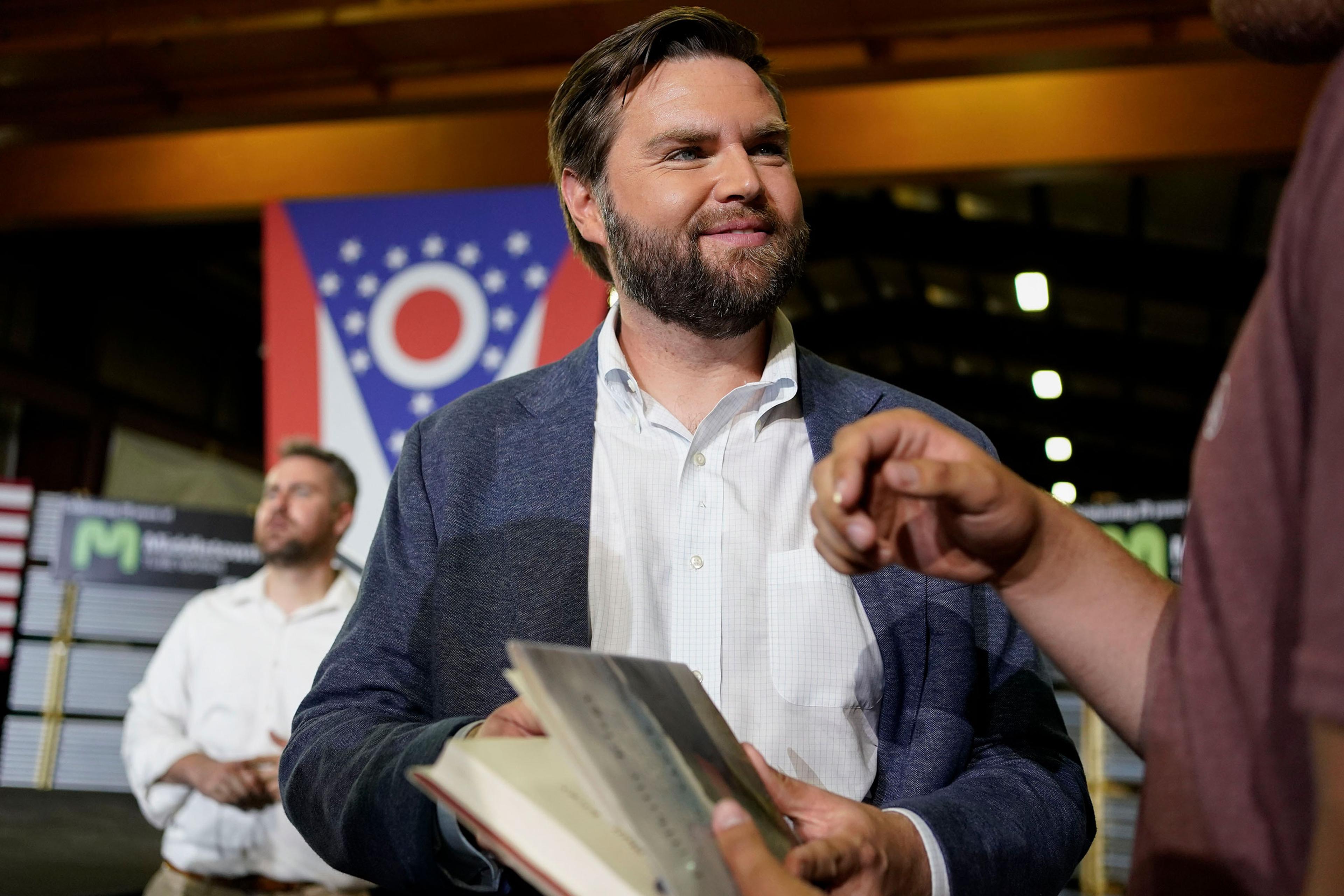 JD Vance, the venture capitalist and author of "Hillbilly Elegy," speaks with supporters after a rally in Middletown, Ohio, on July 1, 2021.