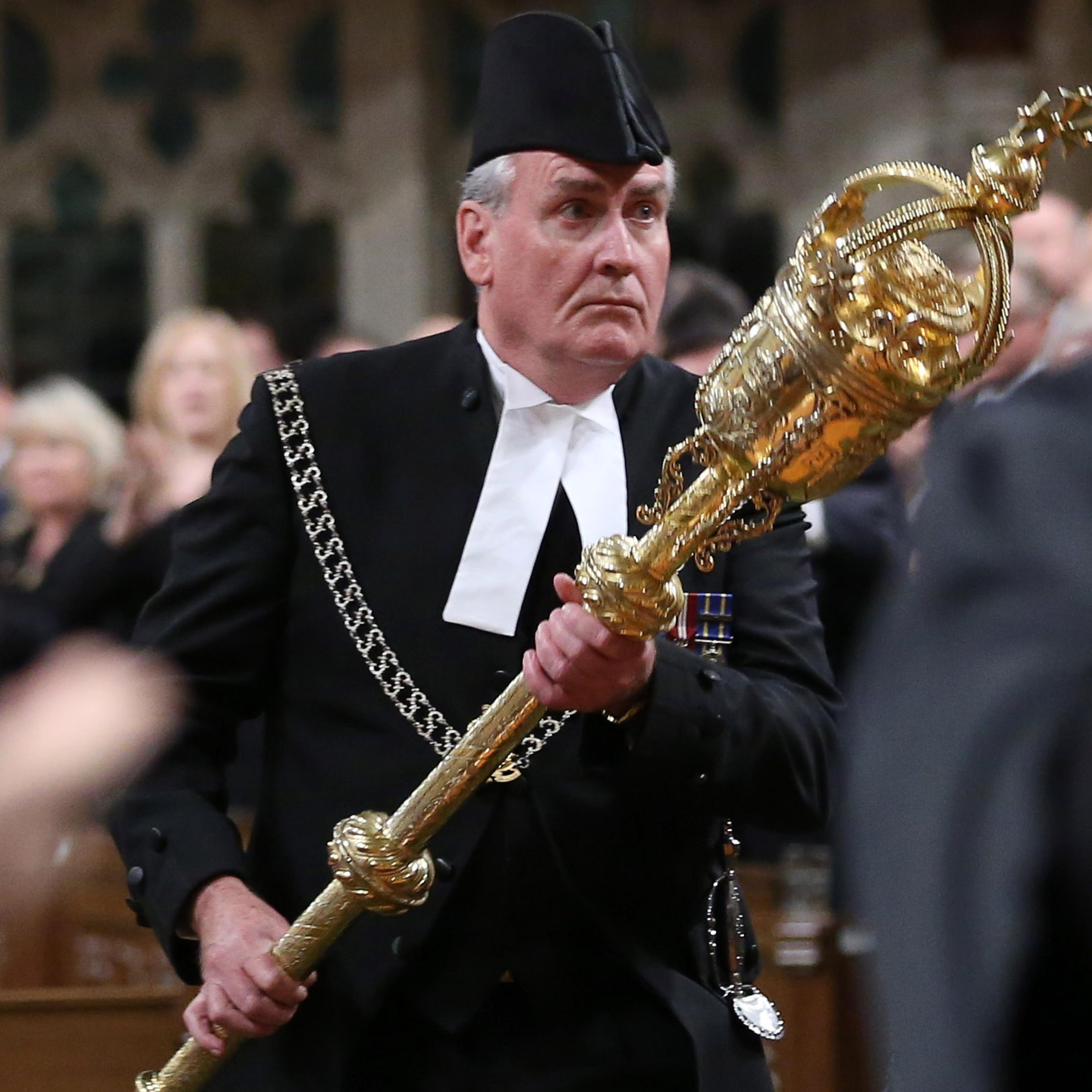 Sergeant-at-Arms Kevin Vickers is applauded in the House of Commons in Ottawa