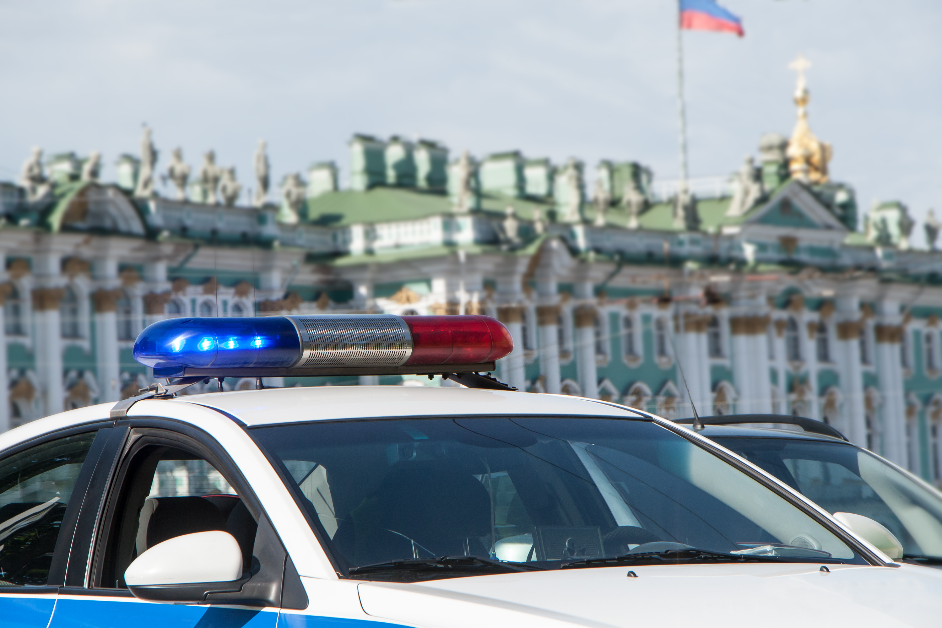 Police cars in front of the State Hermitage Museum in St. Petersburg, Russia.