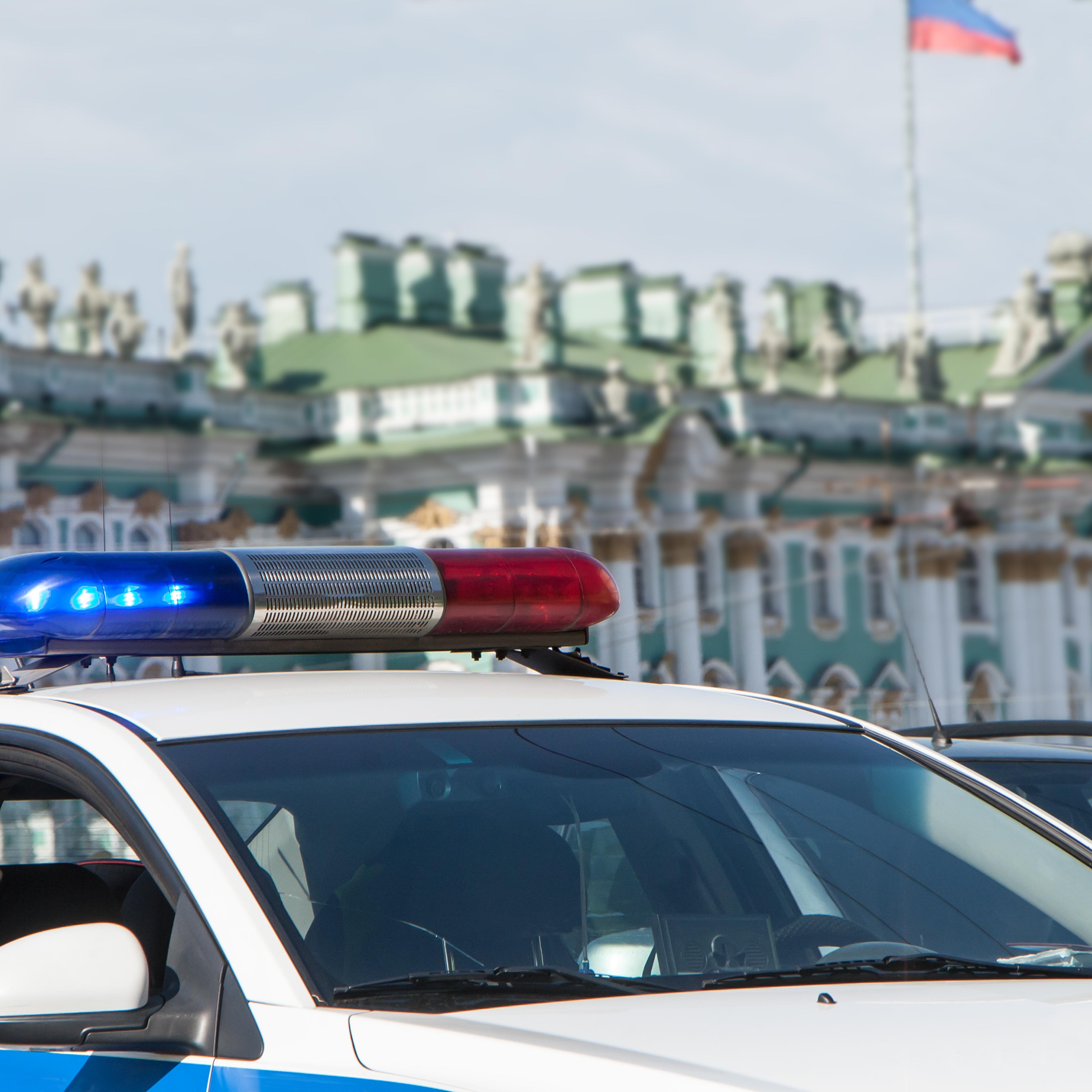 Police cars in front of the State Hermitage Museum in St. Petersburg, Russia.