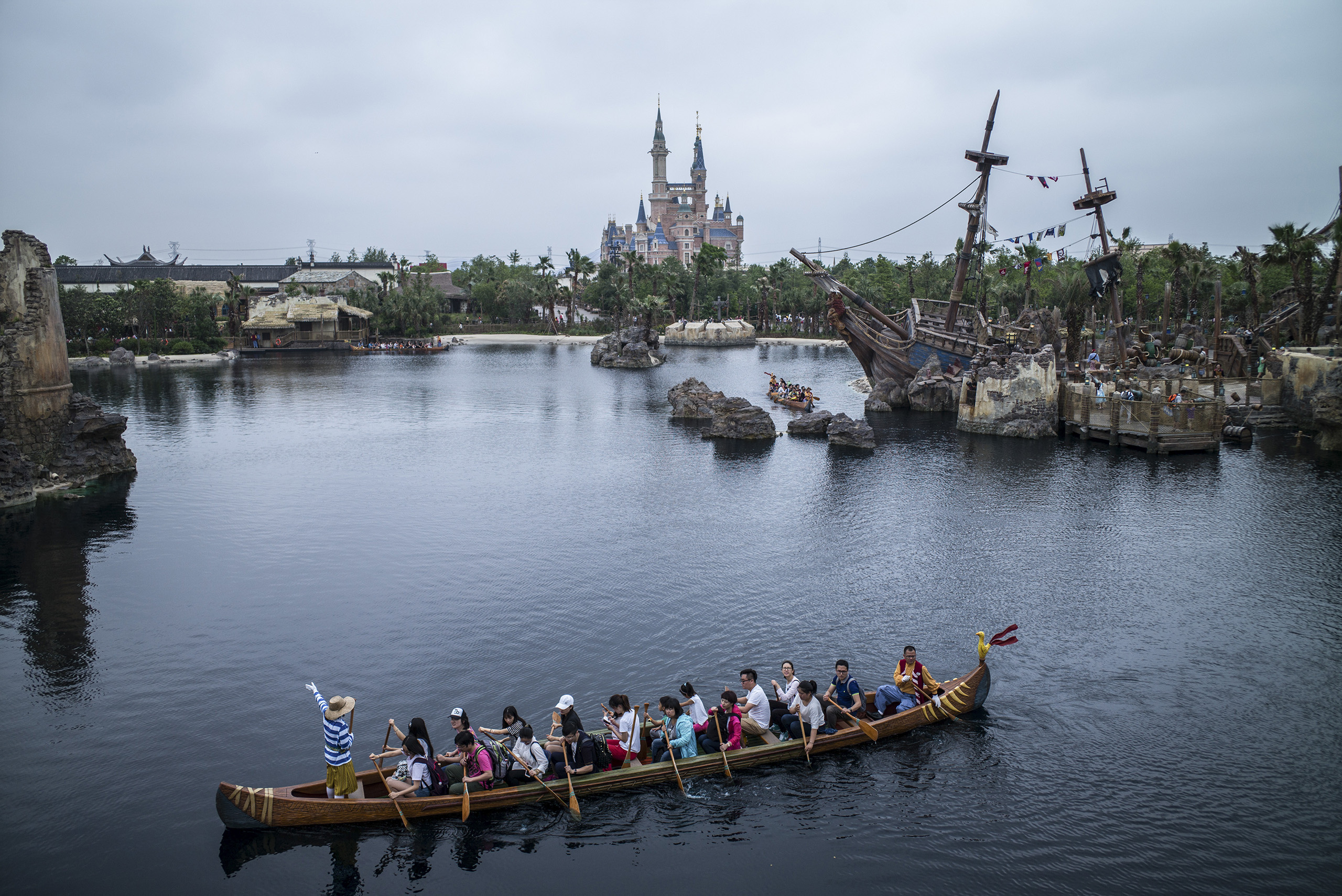 Visitors take the canoe ride at Treasure Cove during a preview at Shanghai Disneyland, June 10, 2016.