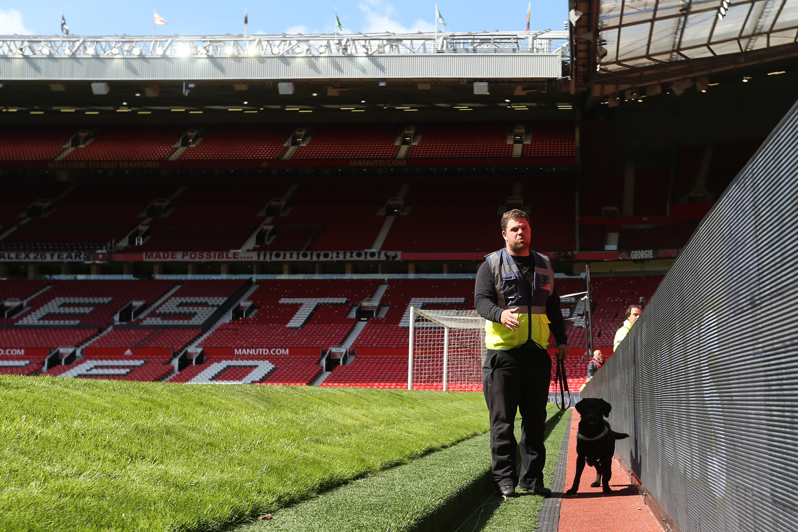MANCHESTER, UNITED KINGDOM - MAY 15: A sniffer dog patrols pitchside as the match is abandoned with fans evacuated from the ground prior to the Barclays Premier League match between Manchester United and AFC Bournemouth at Old Trafford on May 15, 2016 in