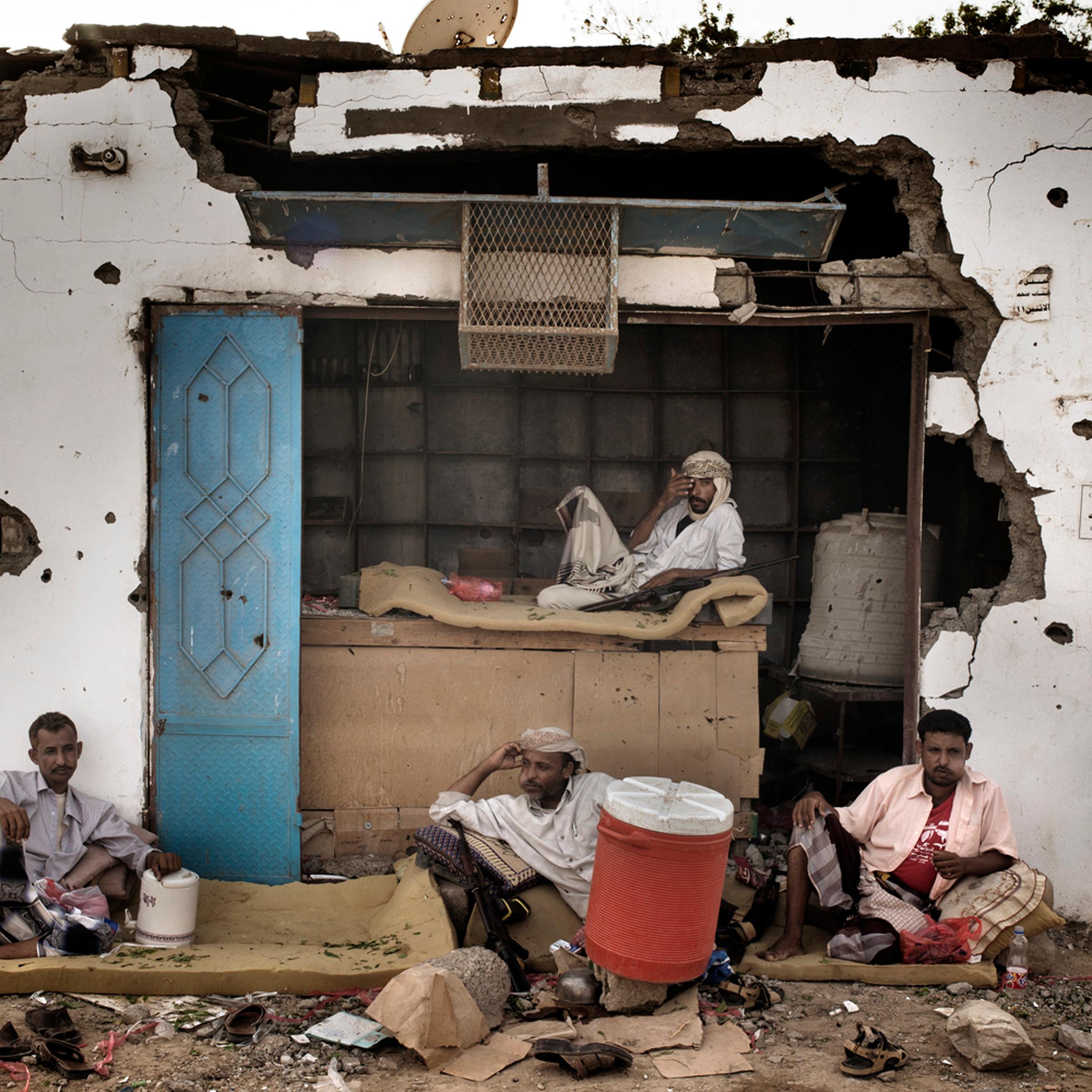 <em>The following photographs were taken in July 2012</em><br>
A member of the 'Popular Committee' in Hajjar takes a mid-afternoon break to chew "qat," a mildly narcotic leaf favored by Yemenis.