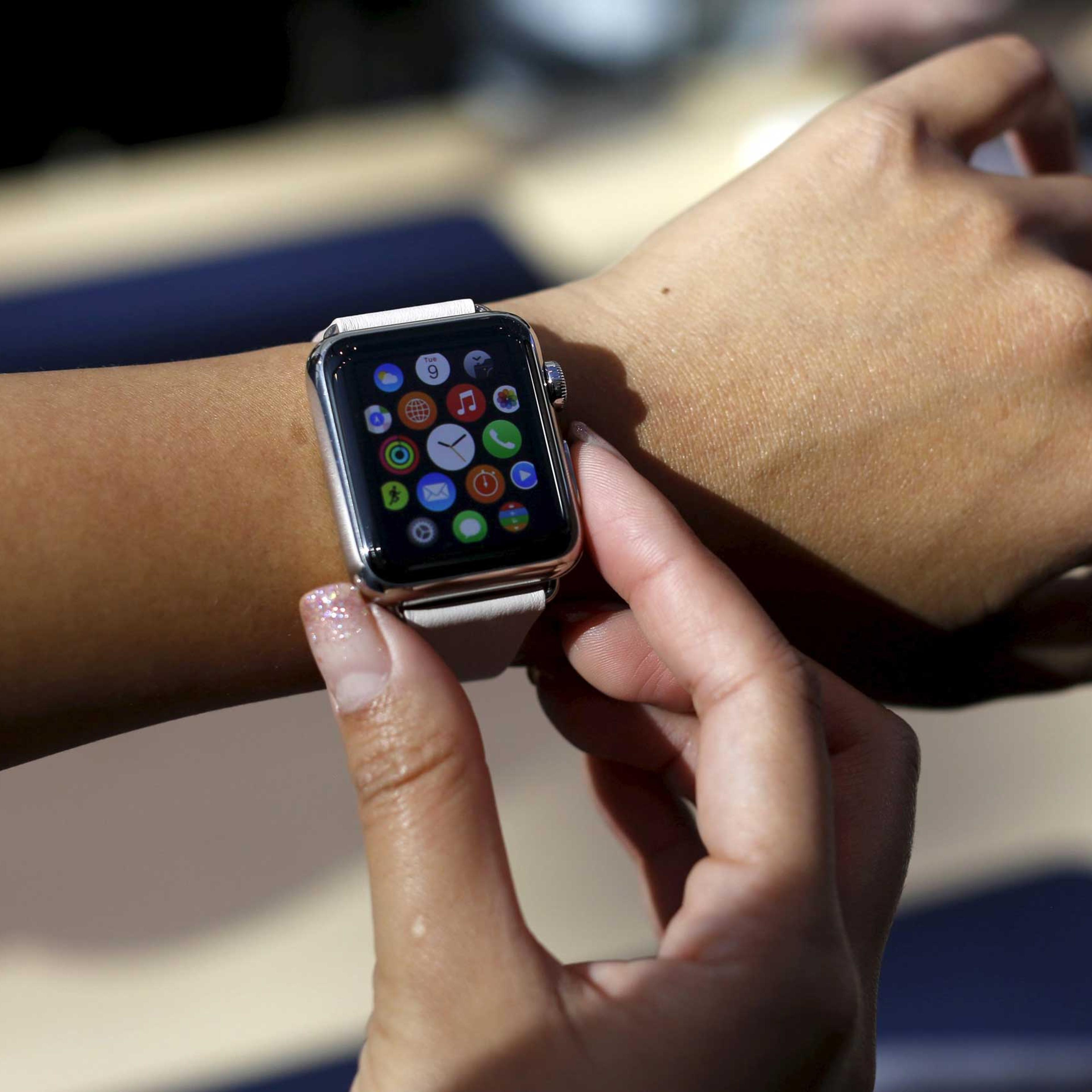A customer tries on an Apple Watch in Palo Alto, Calif. on April 10, 2015.