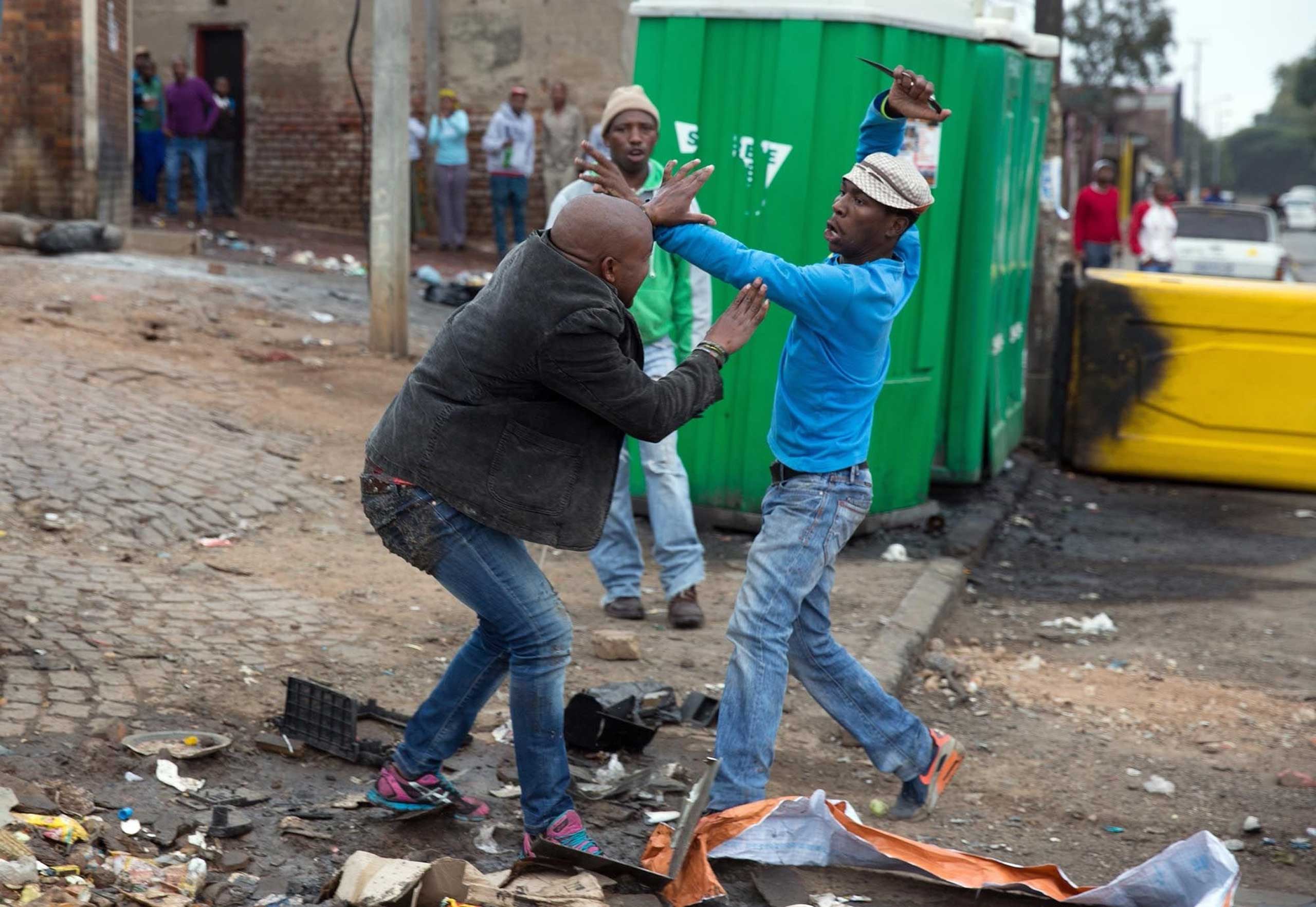 The Story Behind the Photo of a Brutal Killing in South Africa
