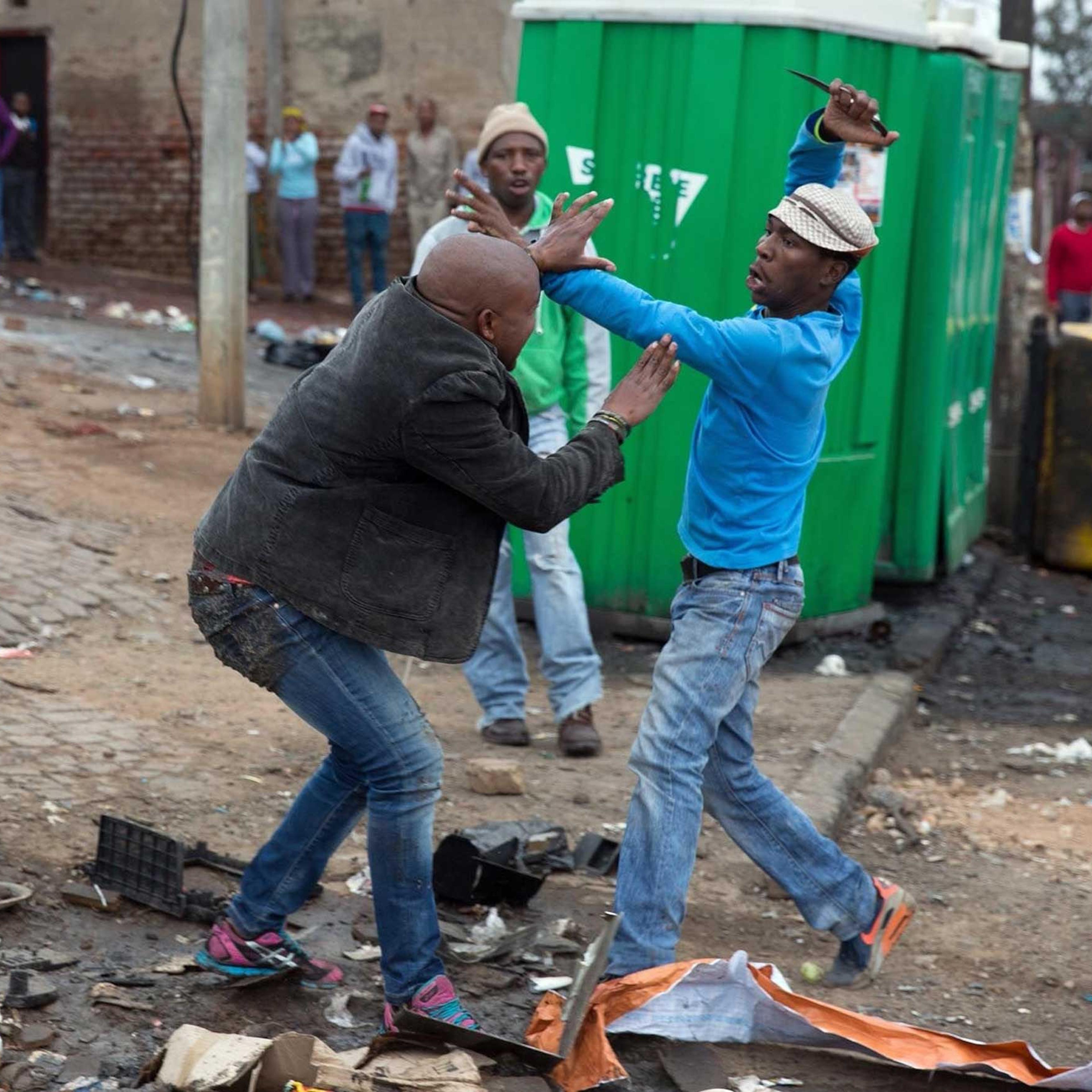 Mozambique national Emmanuel Sithole is attacked by men in Alexandra township during anti-immigrant violence in Johannesburg on April 18, 2015. He later died of his injuries.