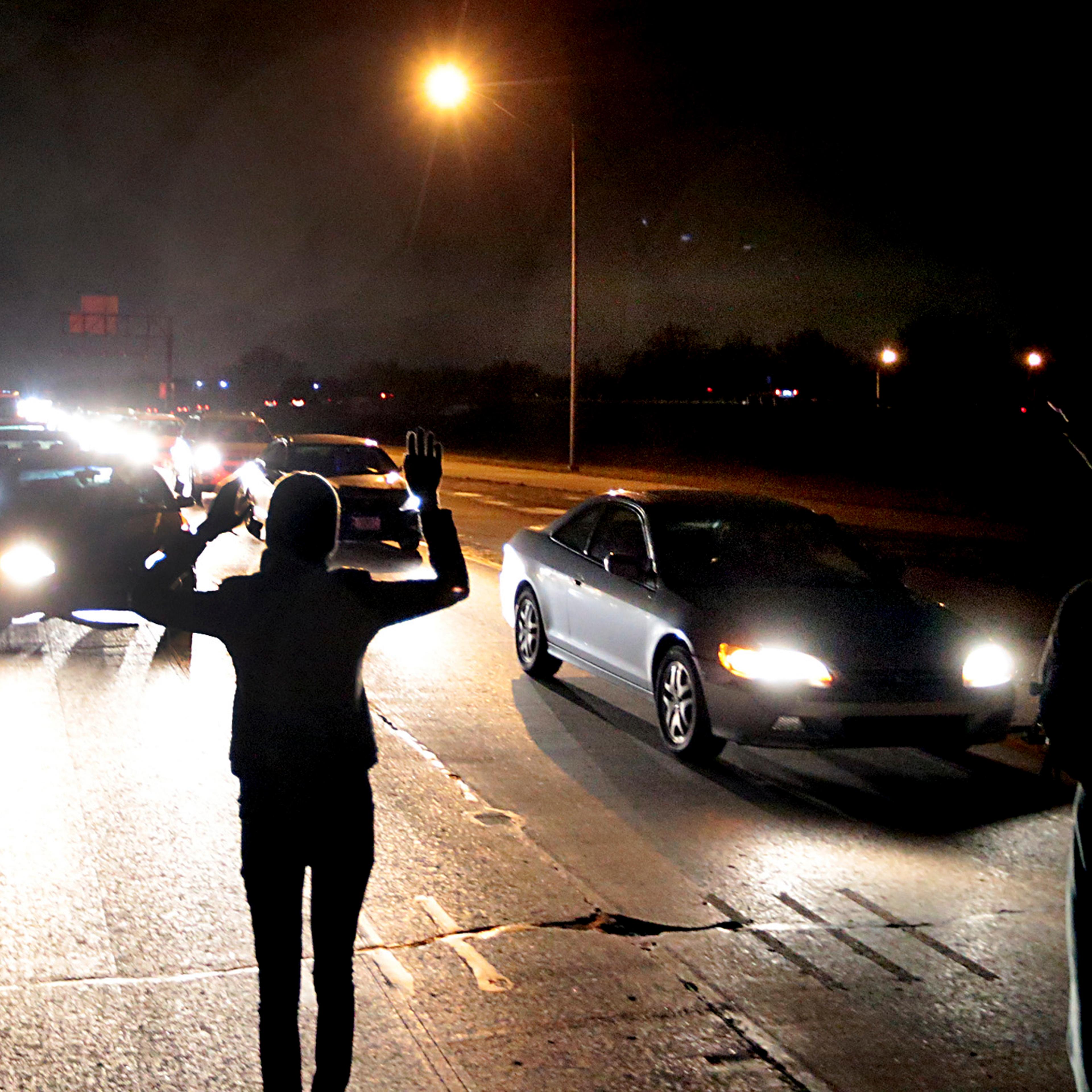 Protesters shut down an interstate at Airport Road on Dec. 24, 2014, in Berkeley, Mo.