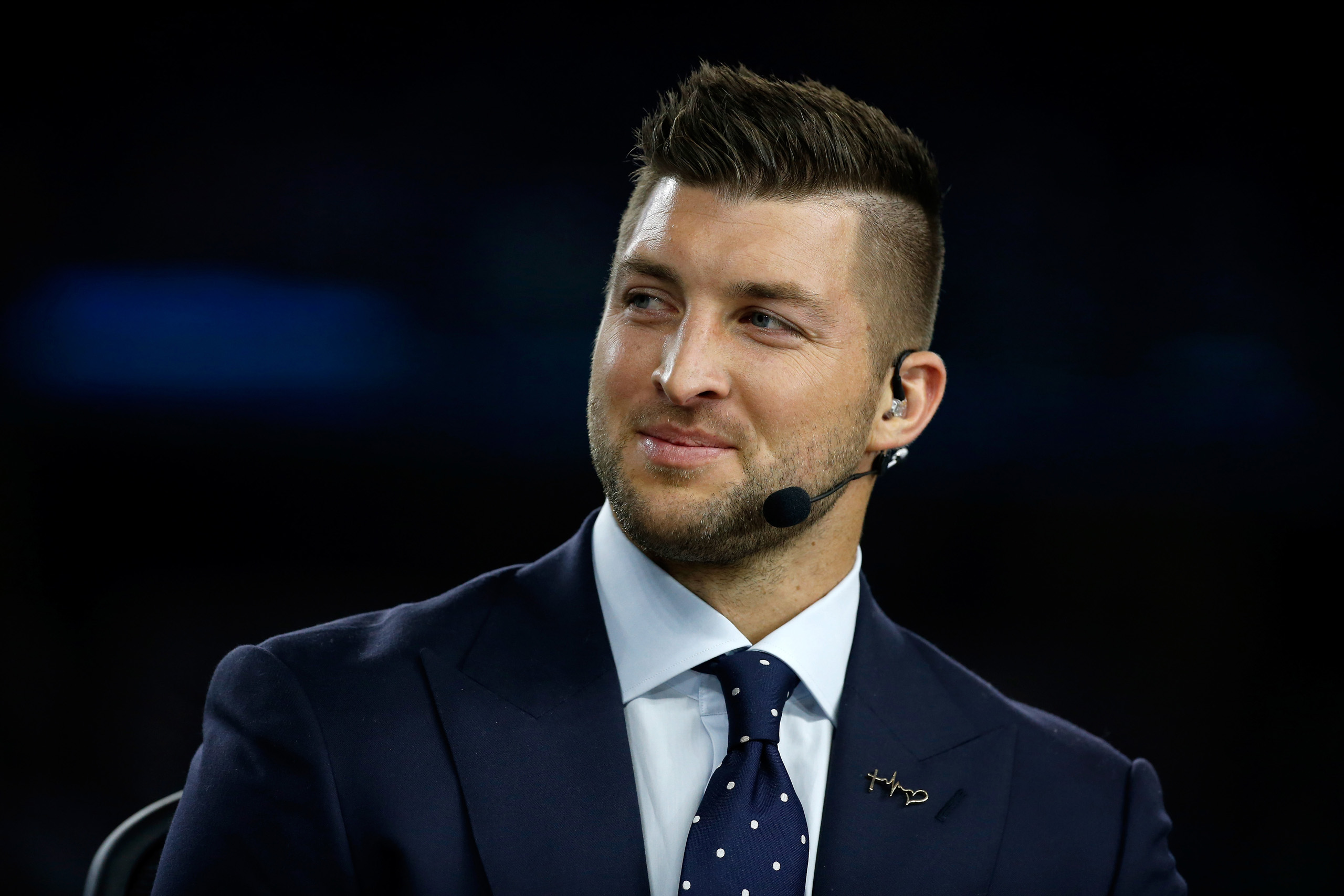 Tim Tebow of the SEC Network speaks on air before the Goodyear Cotton Bowl at AT and T Stadium in Arlington, Texas on Dec. 31, 2015.
