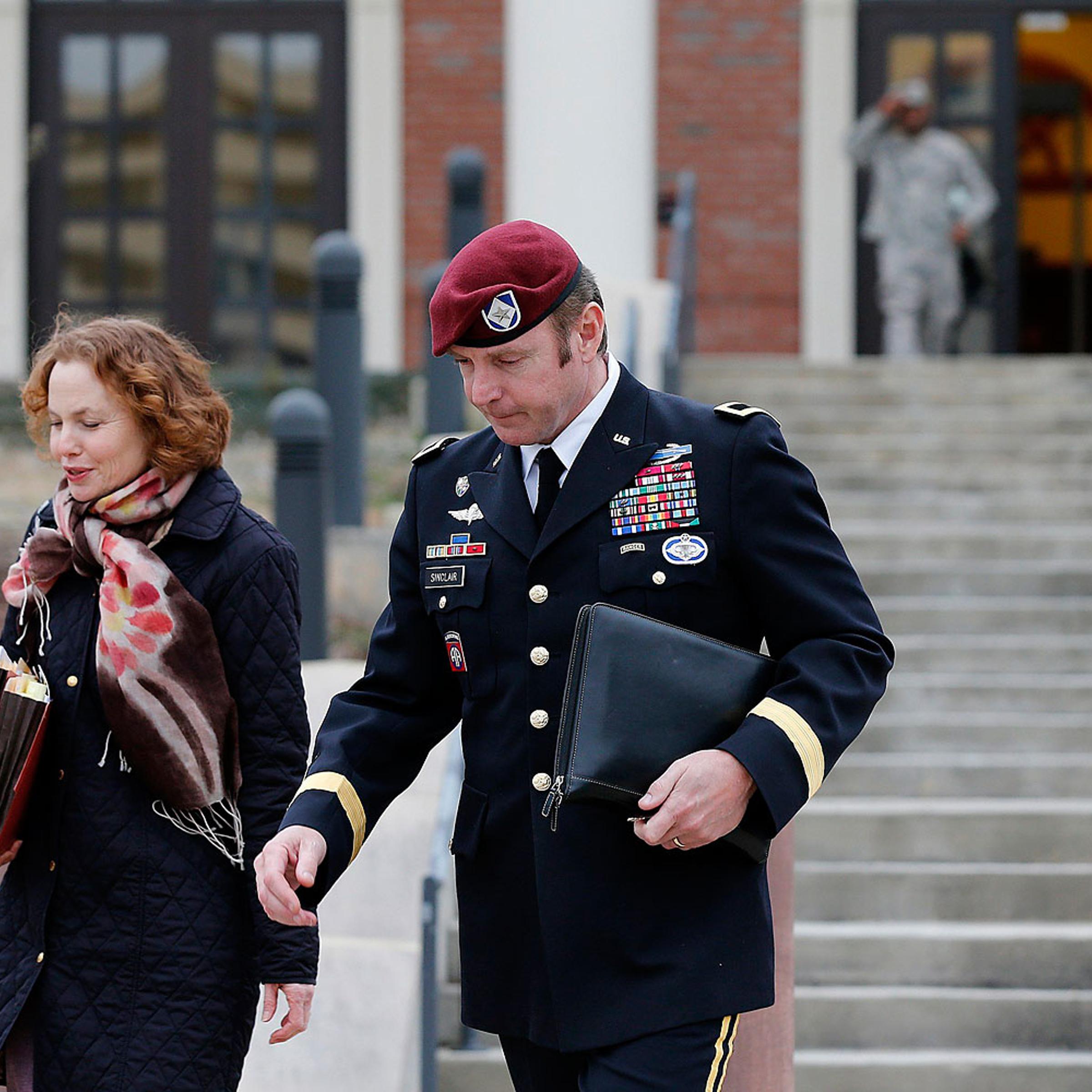 Army Brigadier General Jeffrey Sinclair leaves the courthouse with one of his attorneys at Fort Bragg in Fayetteville, N.C., on March 4, 2014.