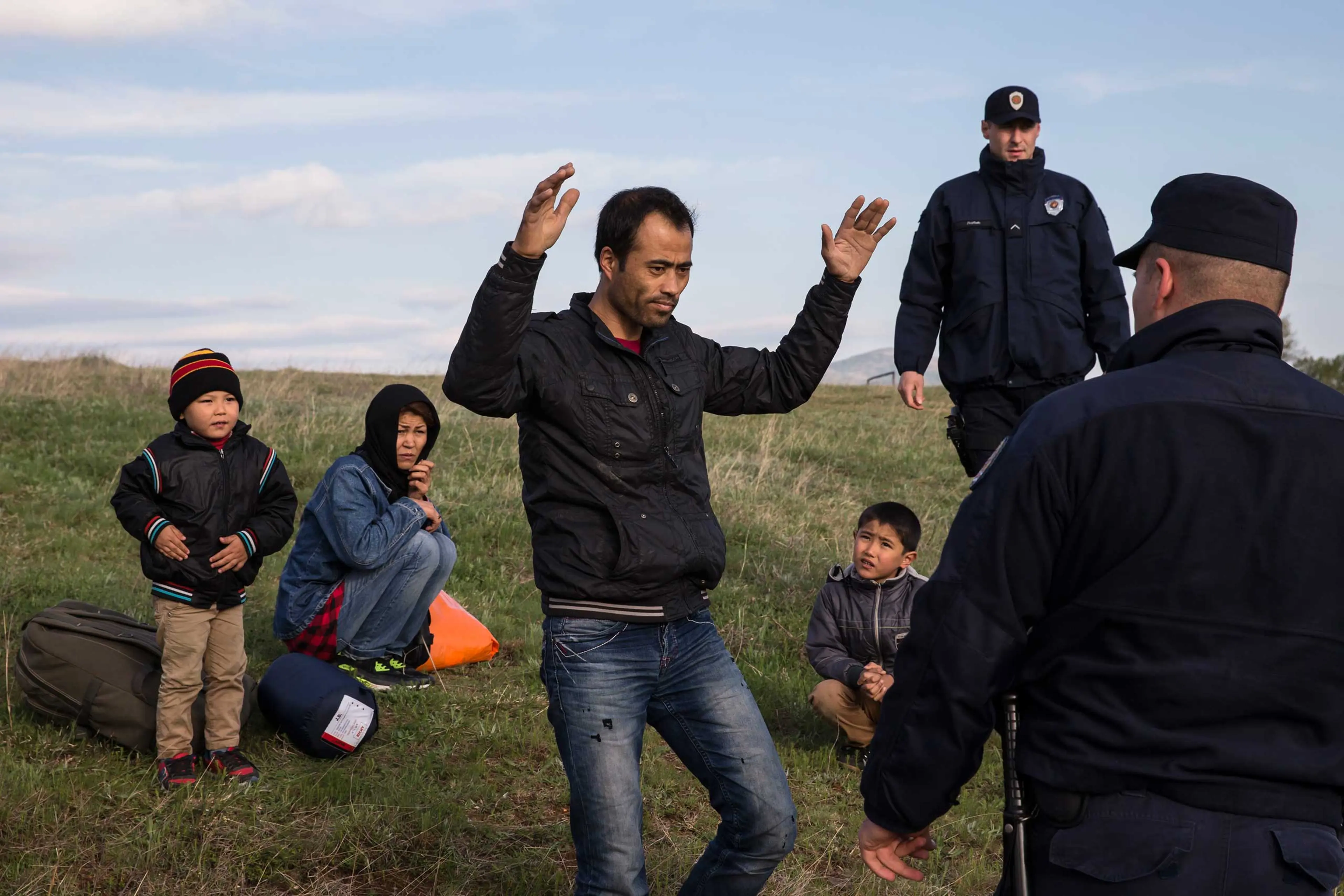 Migrants, who said they were from Afghanistan, sit on a ground after being apprehended by the Serbian border police for having illegally entered the country from Macedonia, near the town of Presevo some 240 miles from capital Belgrade, Serbia on April 29