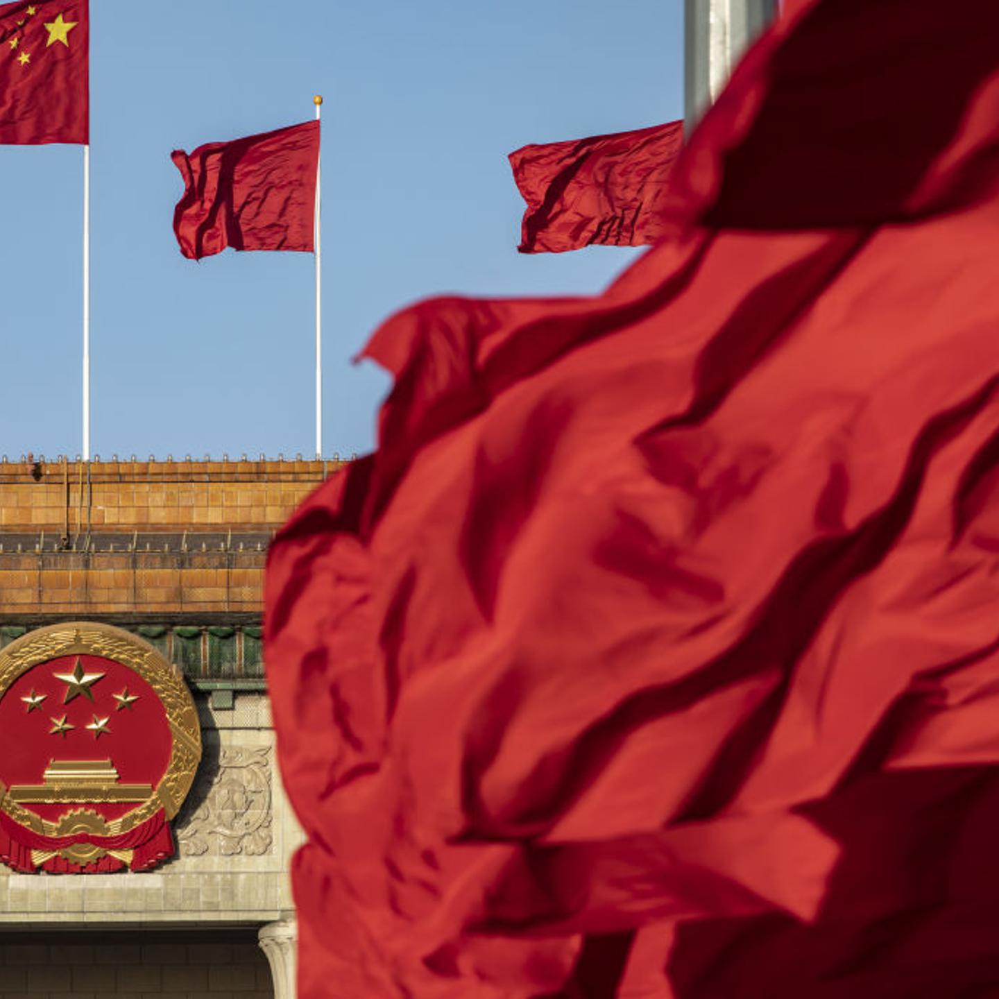 Chinese national flags fly over Tiananmen Square along with other red flags ahead of the fifth plenary session of the First Session of the 14th National People's Congress (NPC) at the Great Hall of the People in Beijing, China, on Sunday, March 12, 2023.