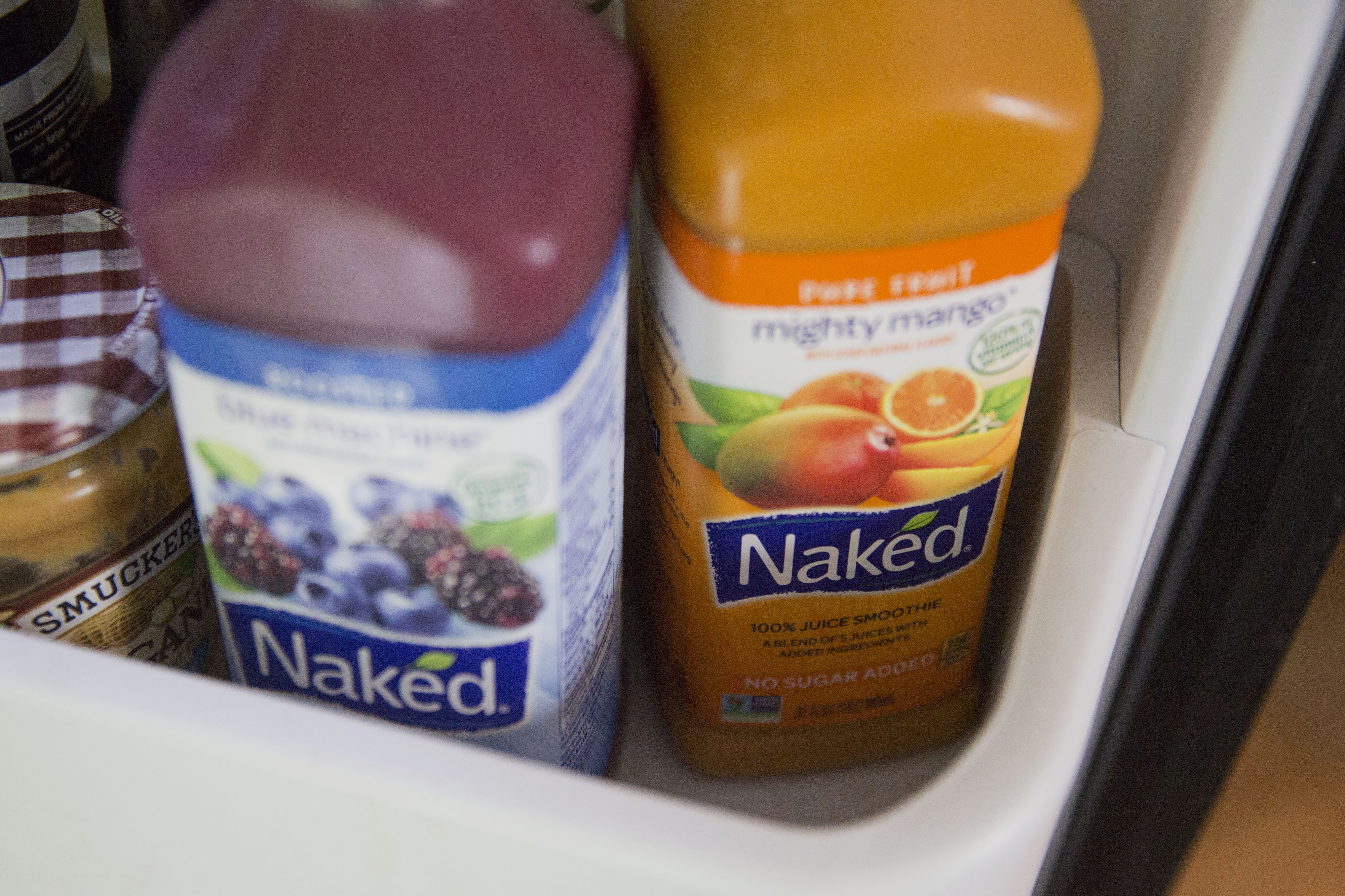 Bottles of PepsiCo Inc. Naked brand juice smoothies are arranged for a photograph in Tiskilwa, Illinois, U.S., on Thursday, July 2, 2015. PepsiCo Inc. is expected to report quarterly earnings on July 9, 2015.
