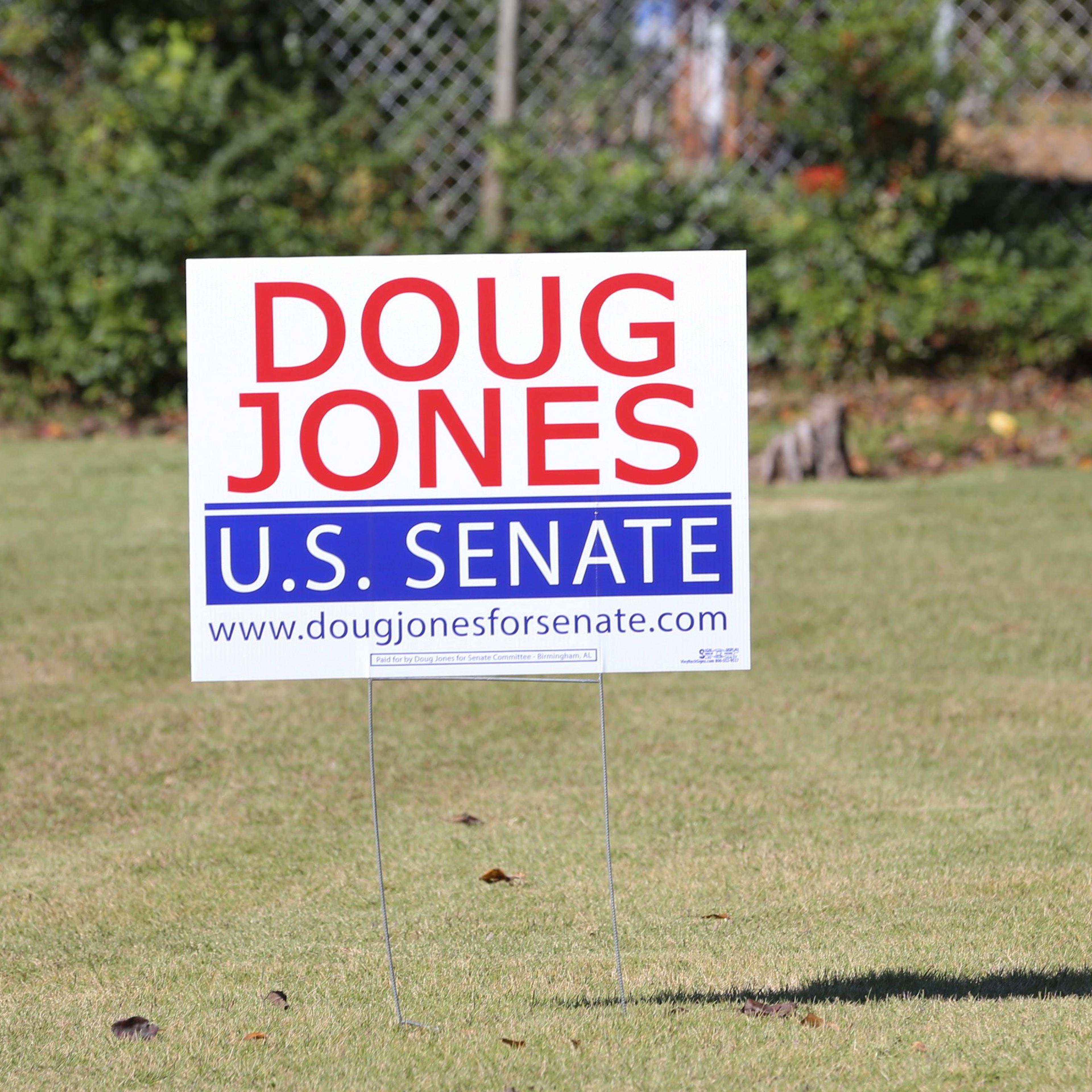 U.S. Senate Democratic candidate Jones' election sign is posted around Jefferson County prior to the upcoming special election against Republican candidate Moore in Hoover