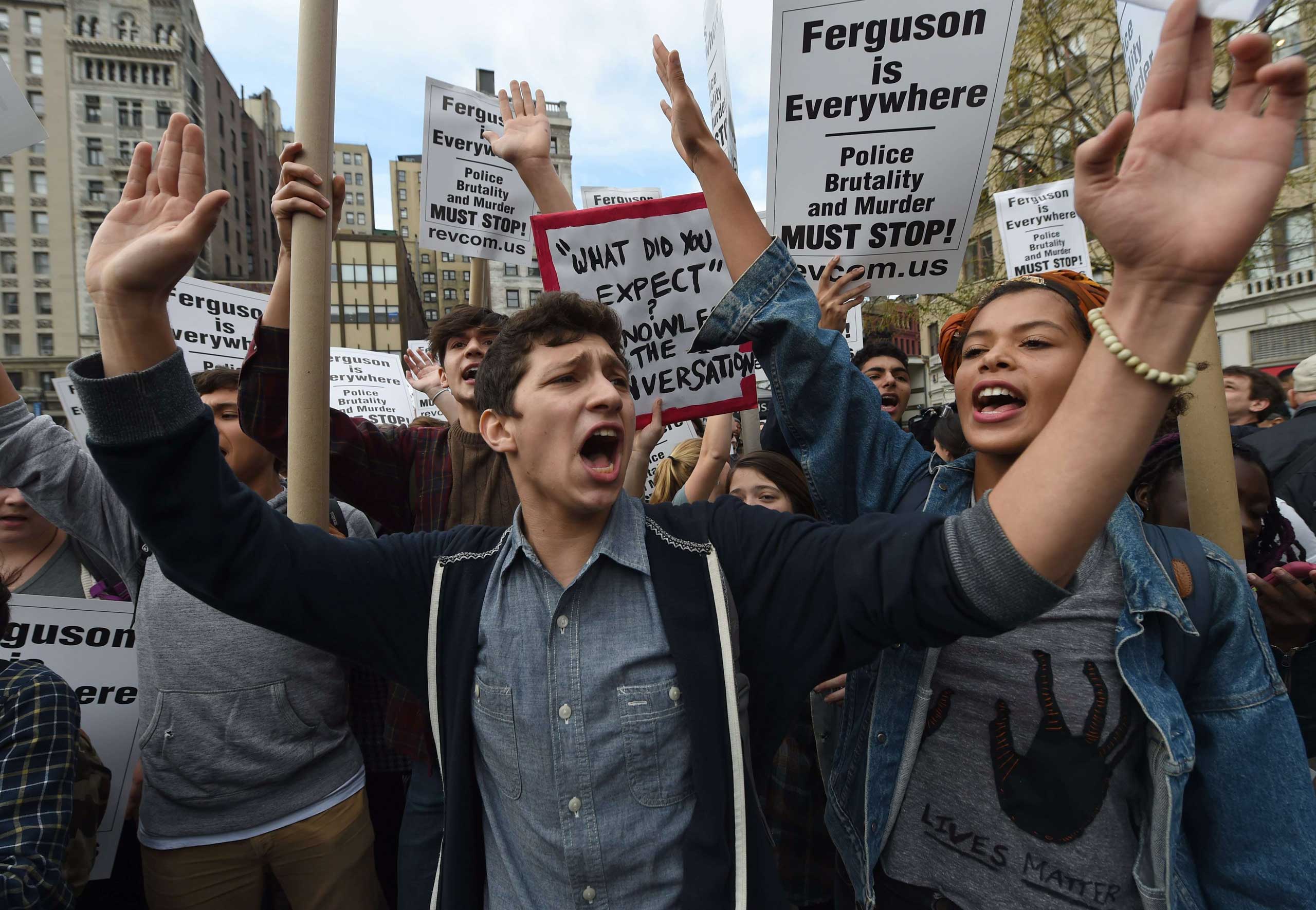 US-CRIME-POLICE-RACISM-HANDS UP